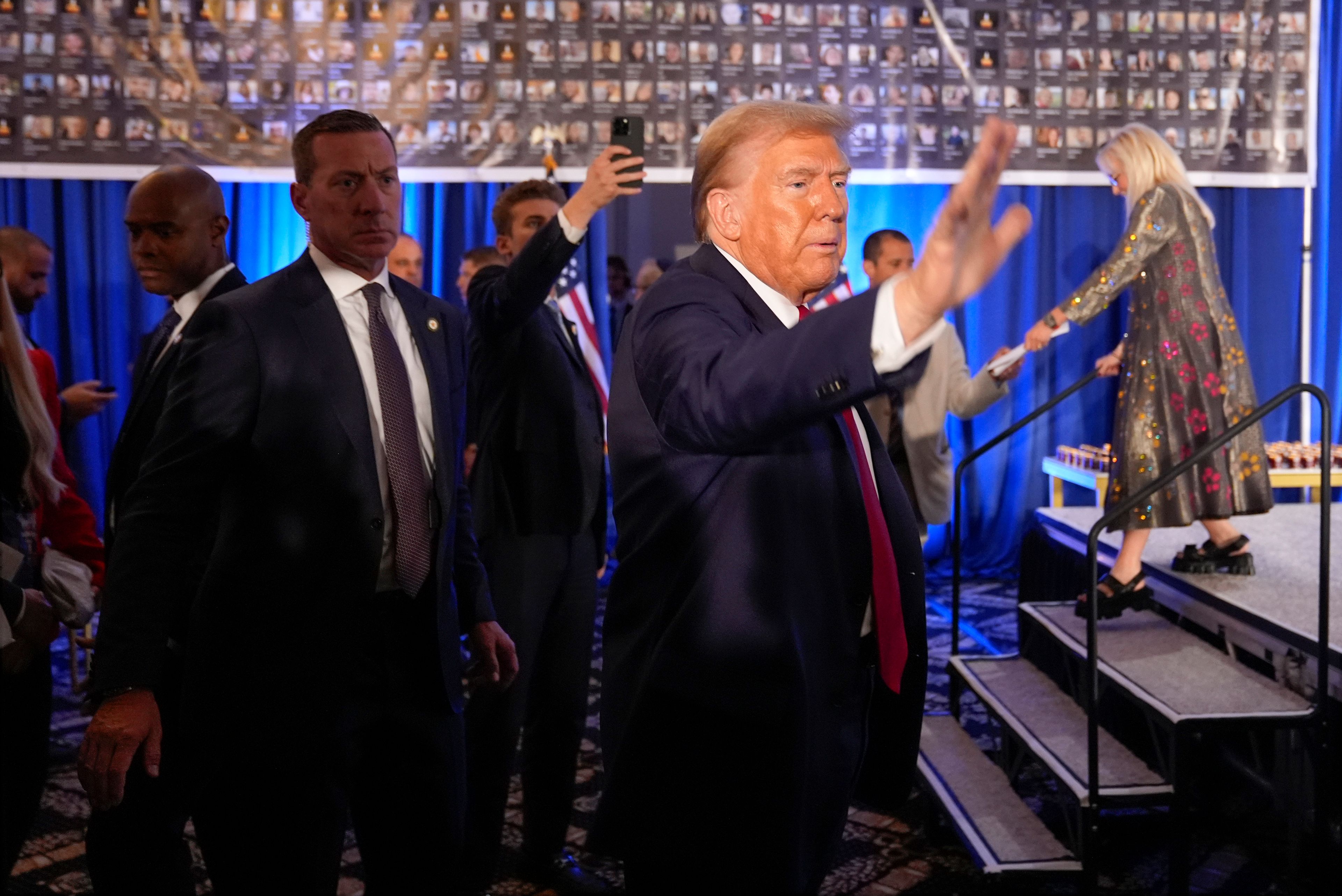 Republican presidential nominee former President Donald Trump waves as he departs an event marking one year since the Oct. 7 Hamas attack on Israel, Monday, Oct. 7, 2024, in Miami. (AP Photo/Alex Brandon)