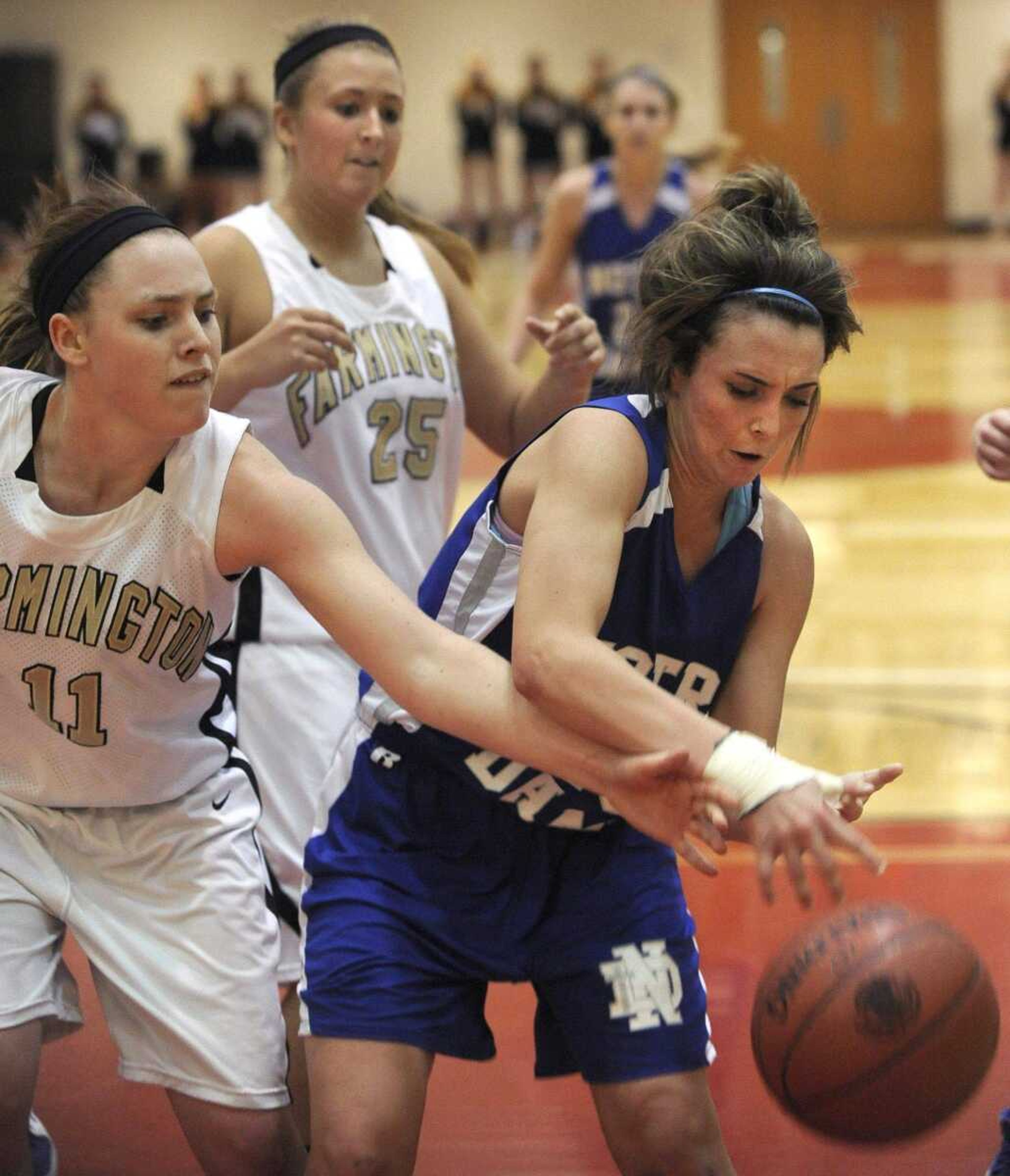 Notre Dame's Brooke Bohnert tries to keep control of the ball against Farmington in the Class 4 sectional game. Bohnert is third on the team in scoring.