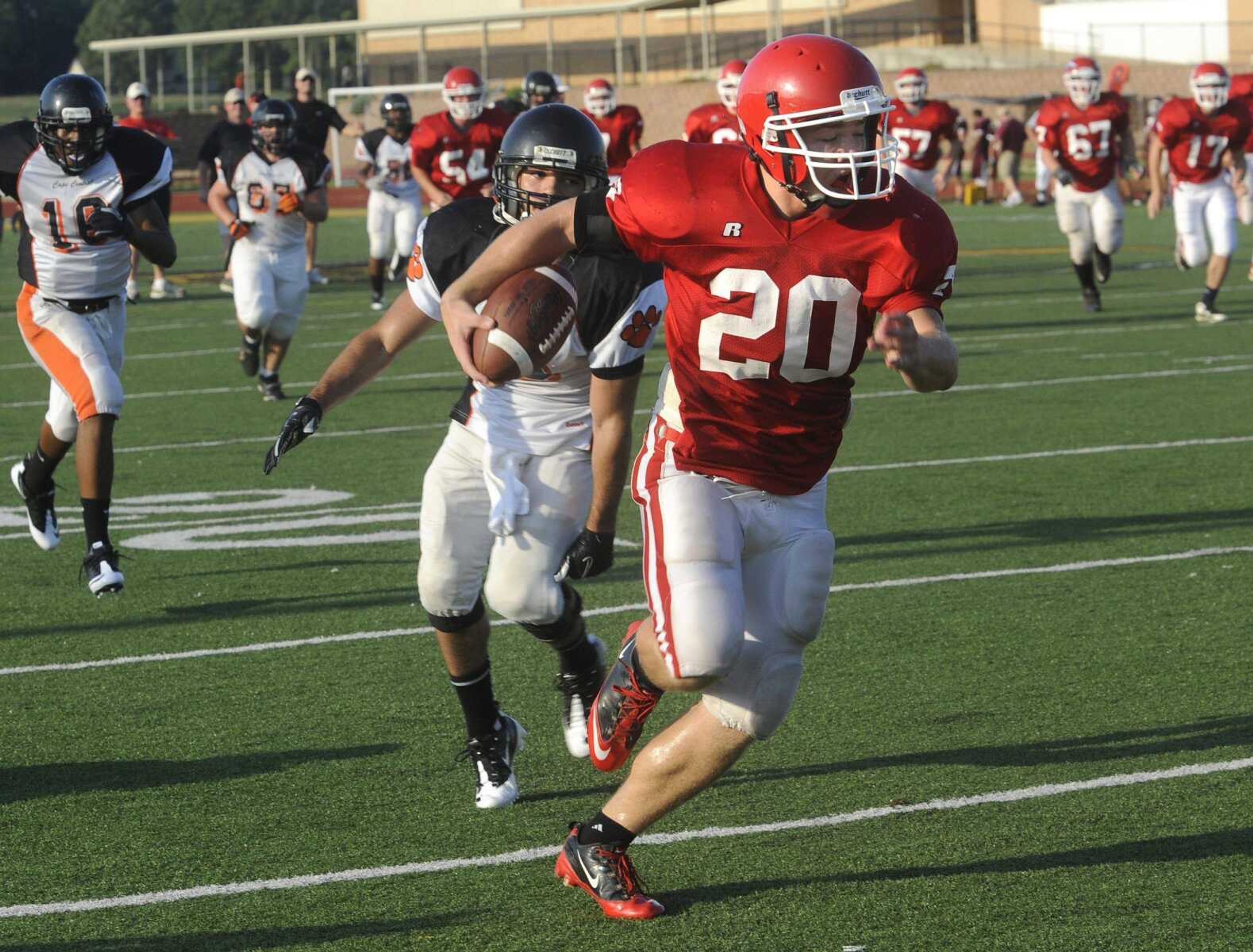 Jackson's Levi Rutherford runs for a touchdown against Central after pulling in a pass from quarterback Lowgn Wren during Friday's jamboree in Farmington, Mo. (Fred Lynch)