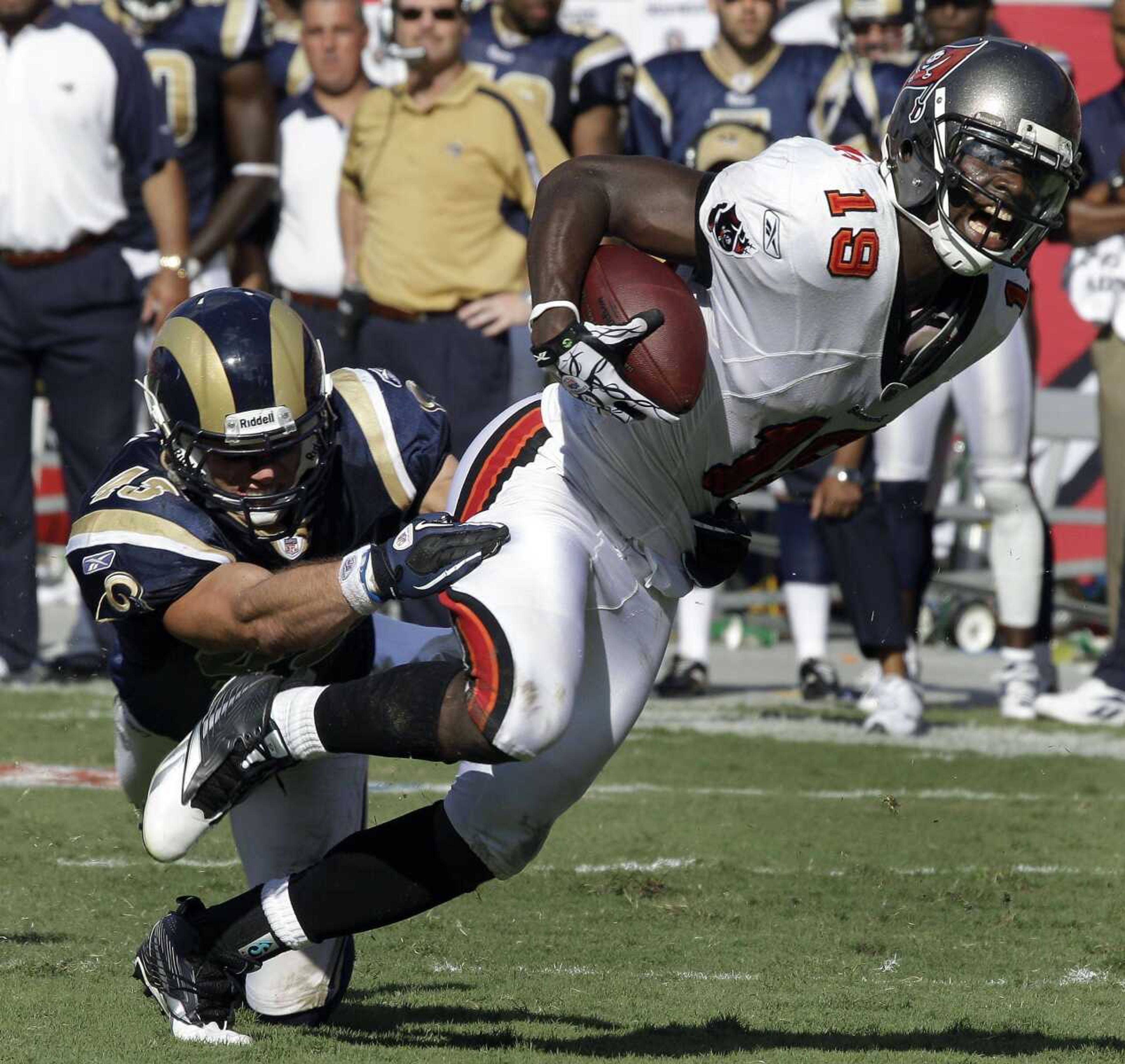 Buccaneers receiver Mike Williams drags Rams safety Craig Dahl to the 1-yard line during the final minute of Sunday's game in Tampa, Fla. (Chris O'Meara ~ Associated Press)