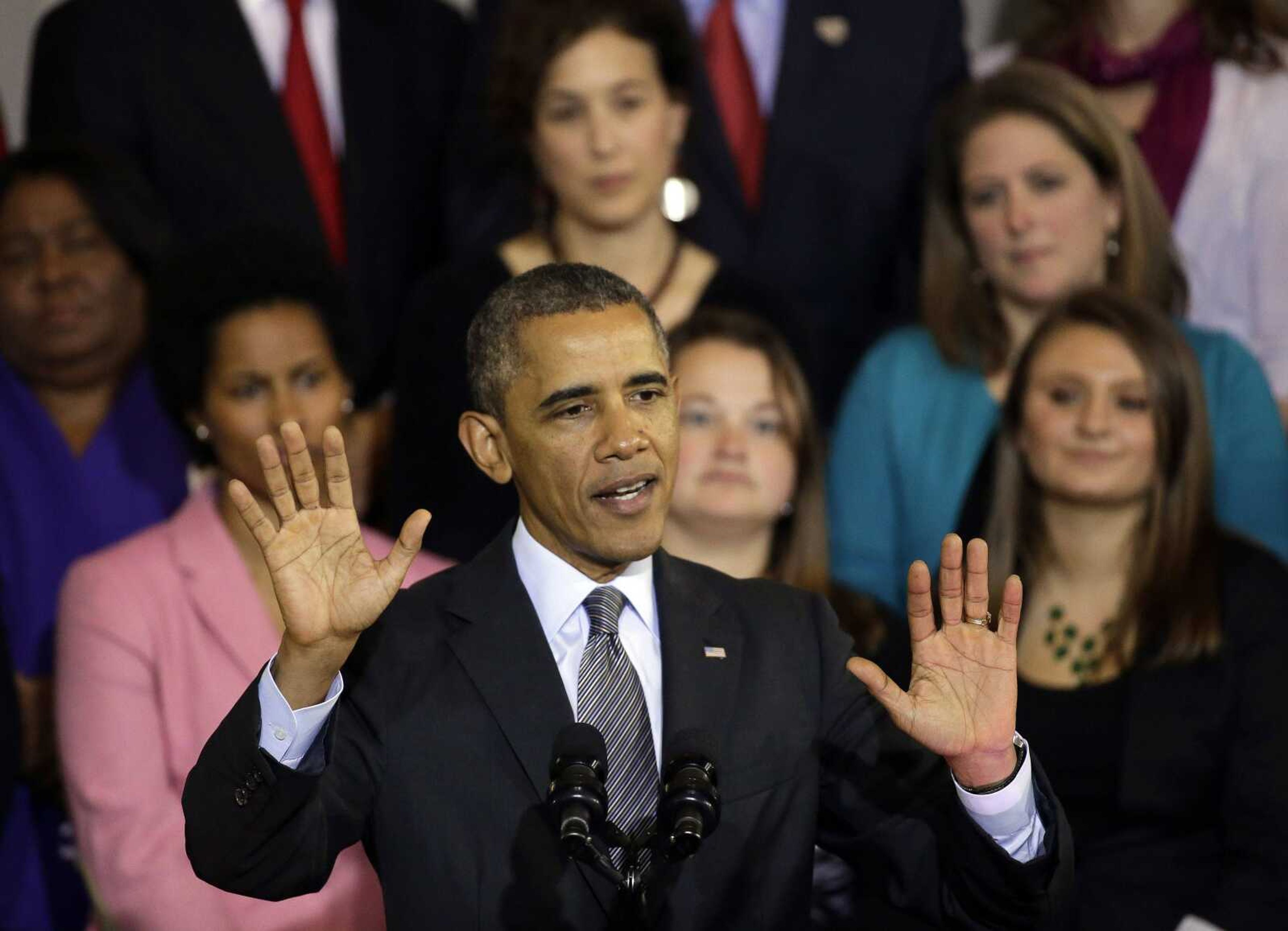 President Barack Obama speaks Wednesday at Boston&#8217;s historic Faneuil Hall about the federal health care law. Faneuil Hall is where former Massachusetts Republican Gov. Mitt Romney signed the state&#8217;s landmark health care law in 2006. (Stephan Savoia ~ Associated Press)