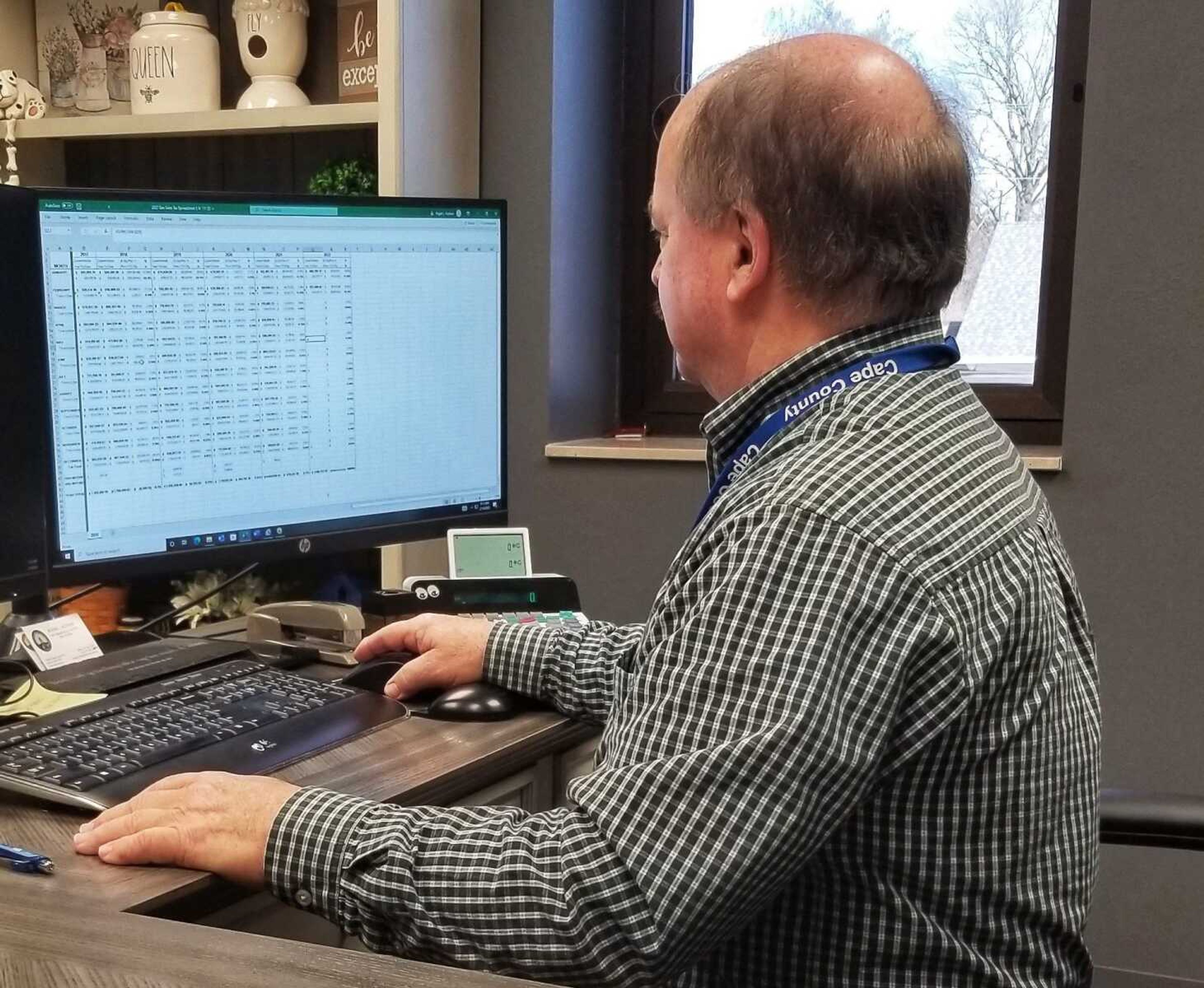 Cape Girardeau County Treasurer Roger Hudson consults an Excel spreadsheet in February 2022 in his office at 1 Barton Square in Jackson. Figures provided via Missouri Department of Revenue and released by Hudson show another potentially record-breaking year may be on the horizon for county general tax revenue, while use tax receipts are also strong thus far in 2023.