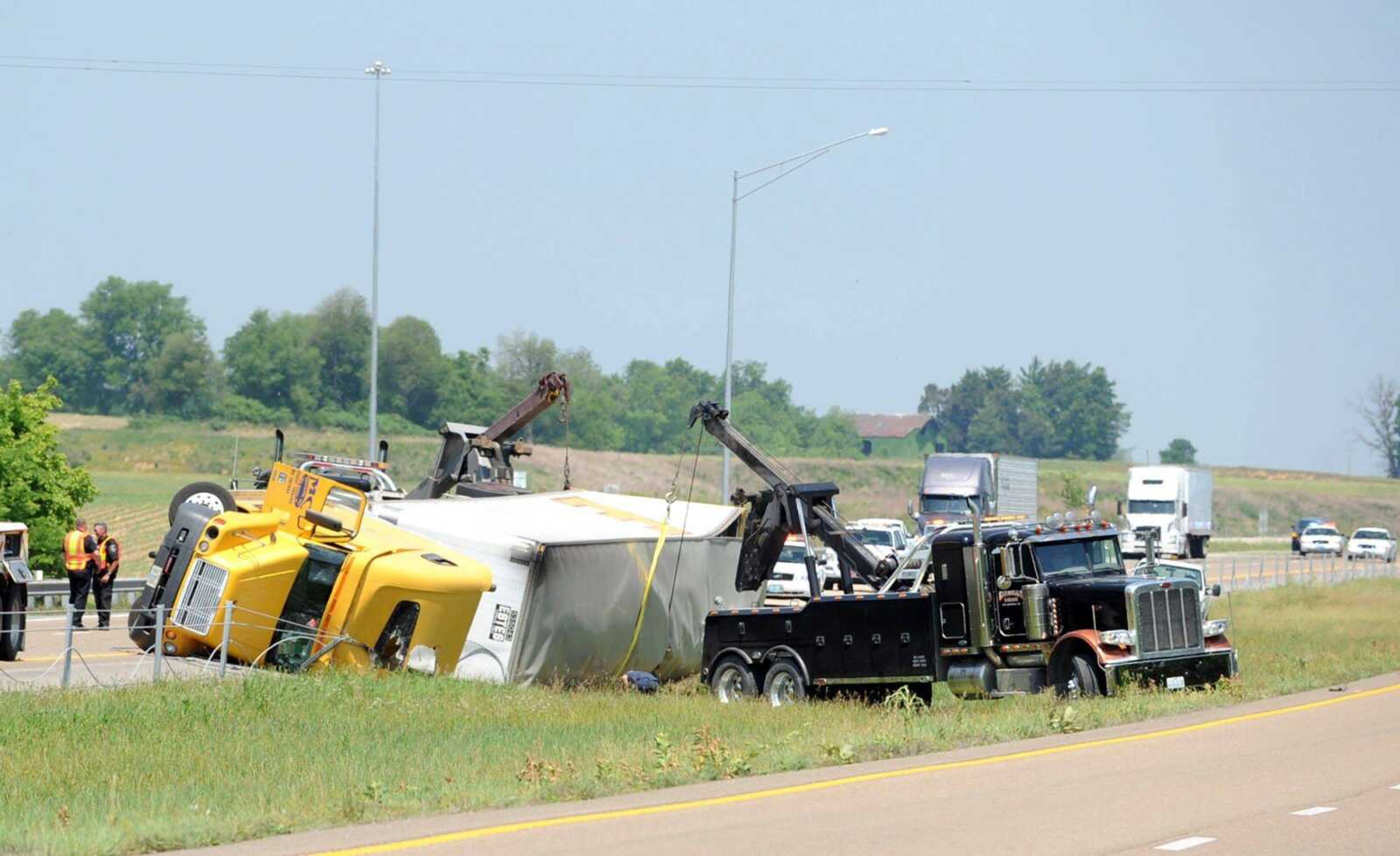 An overturned semi is being lifted upright on Interstate 55. (Laura Simon)