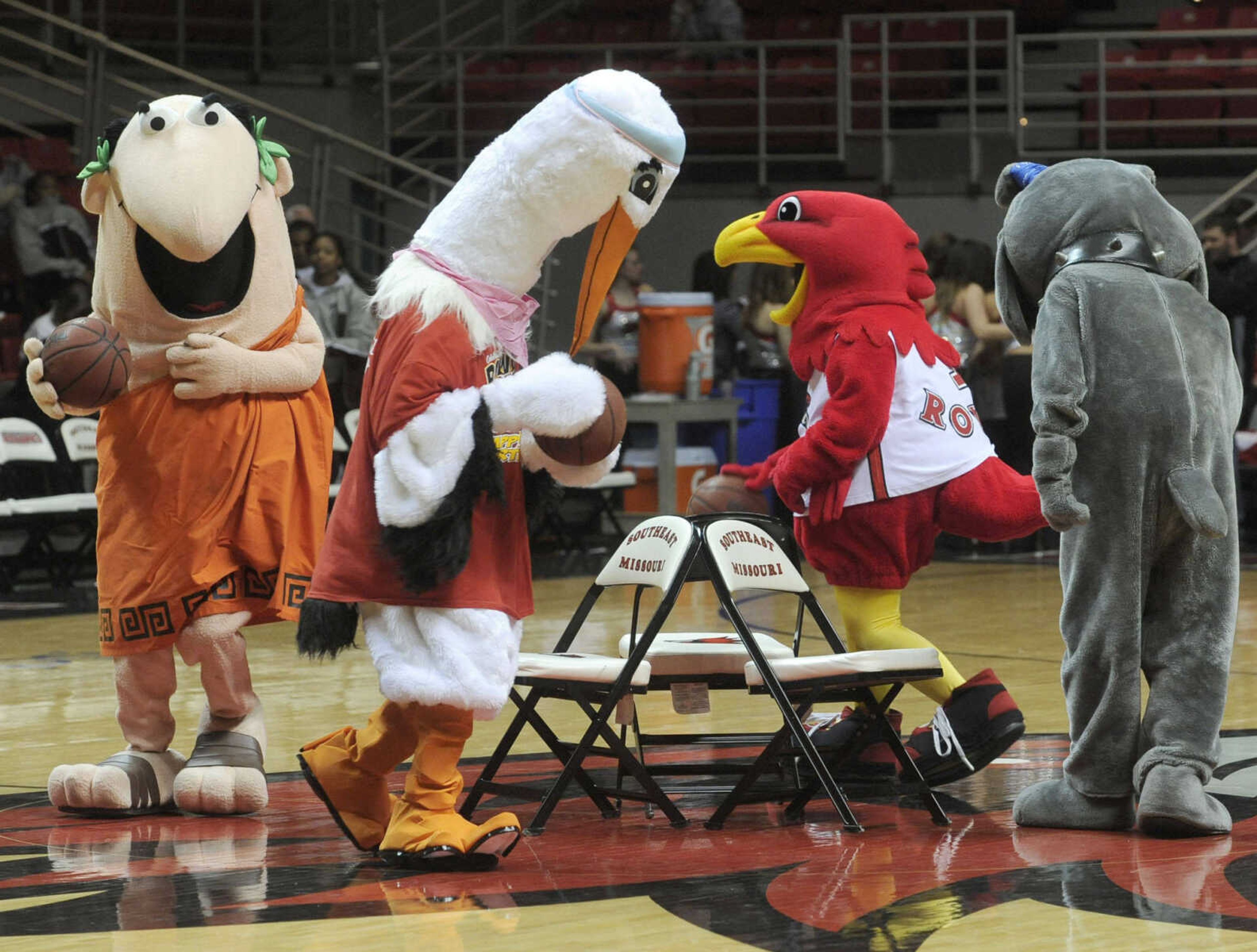 FRED LYNCH ~ flynch@semissourian.com
Rowdy Redhawk and his mascot friends play a game of musical chairs at Rowdy's eighth birthday celebration during halftime of the Southeast Missouri State men's game with Eastern Kentucky Saturday, Feb. 2, 2013 at the Show Me Center. They included Little Caesar, the SoutheastHealth stork and the Notre Dame bulldog.