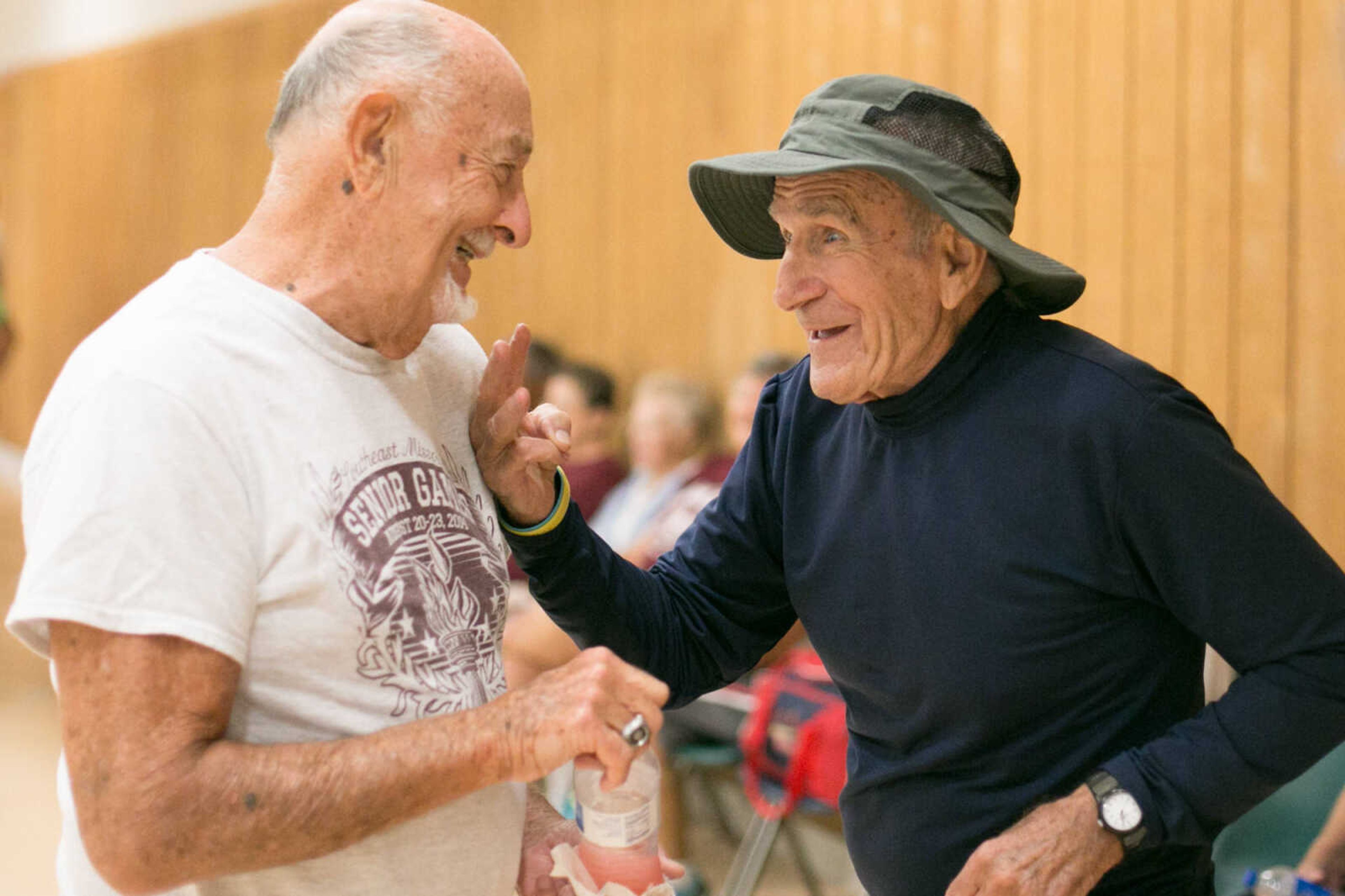 GLENN LANDBERG ~ glandberg@semissourian.com

Bill Cannon, left, and Bob Maschal exchange stories during the first day of the Southeast Missouri Senior Games in Perryville, Missouri Wednesday, Aug. 19, 2015.