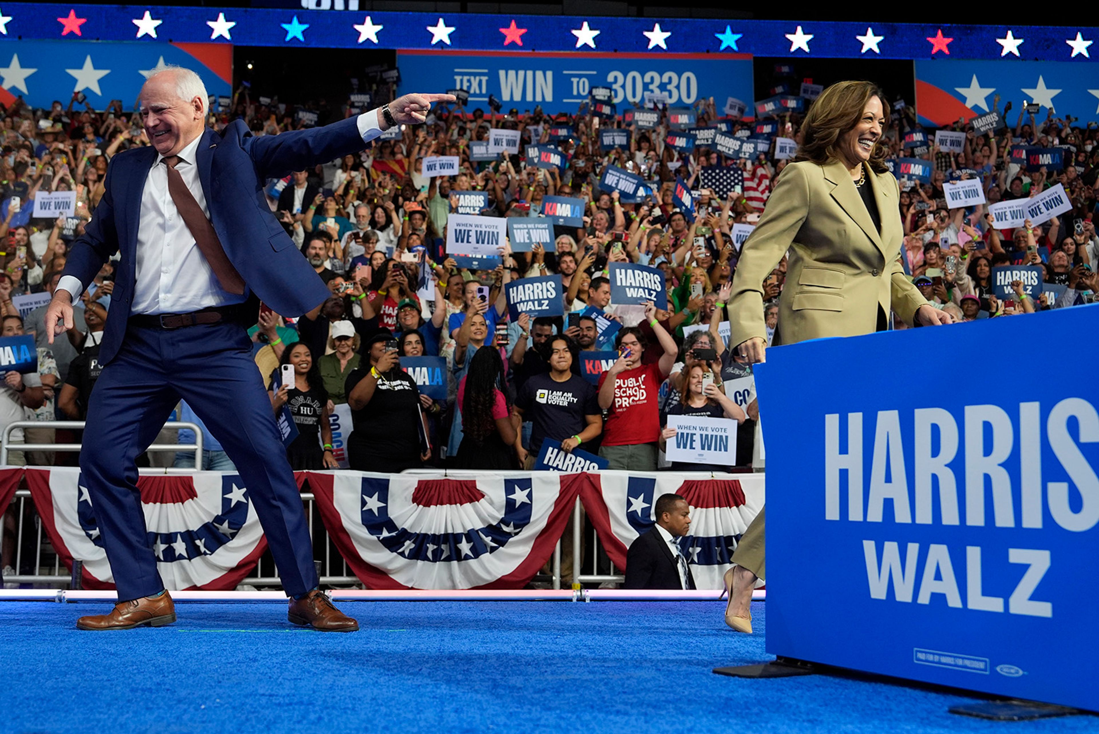 Democratic presidential nominee Vice President Kamala Harris and running mate Minnesota Gov. Tim Walz arrive during a campaign rally at Desert Diamond Arena, Friday, Aug. 9, 2024, in Glendale, Ariz. 