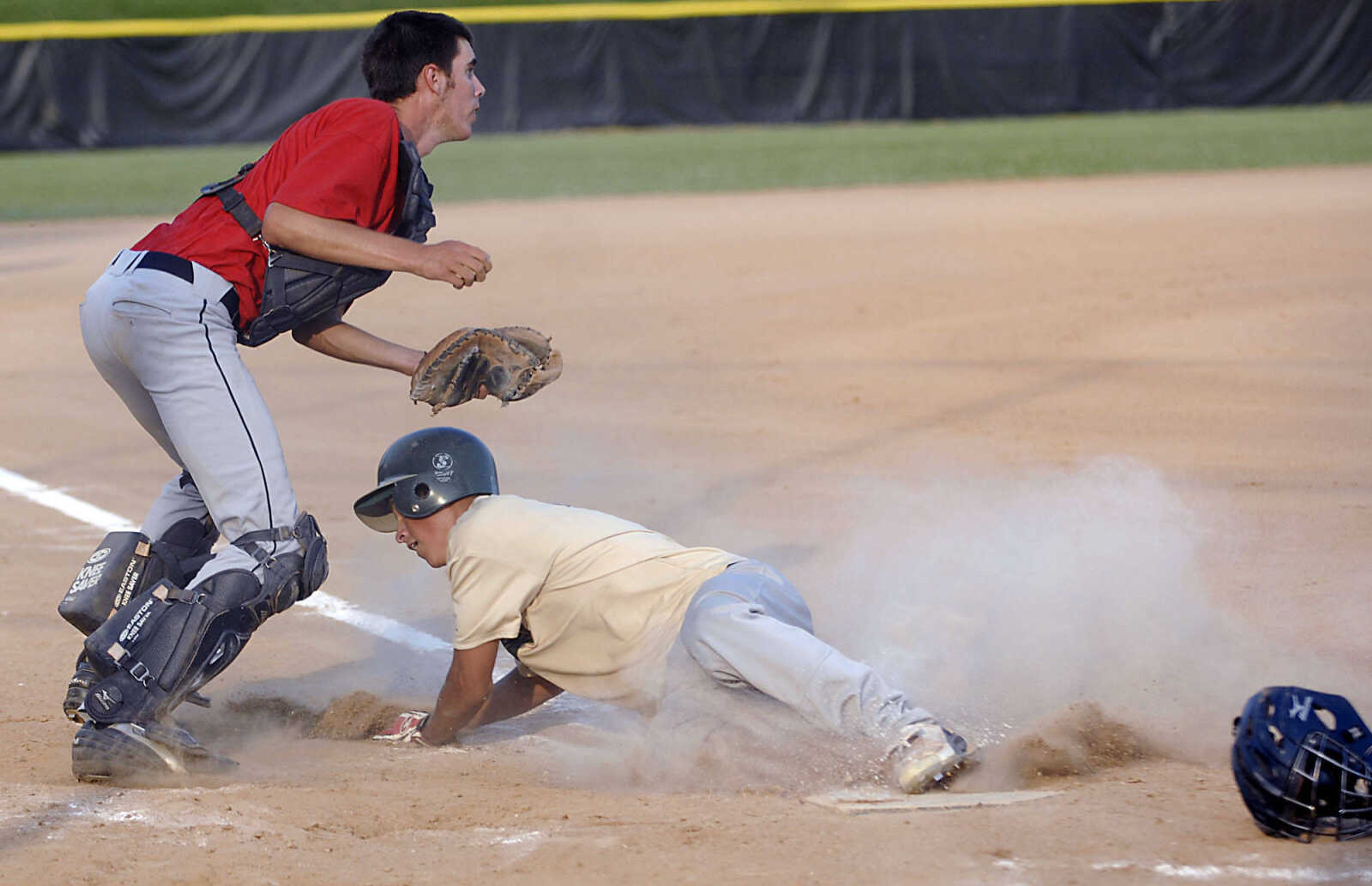 KIT DOYLE ~ kdoyle@semissourian.com
Jackson catcher Bret Steffens looks up for another play after tagging out New Madrid runner Kyle Harris Monday evening, July 6, 2009, in a Senior Babe Ruth game at Jackson City Park.