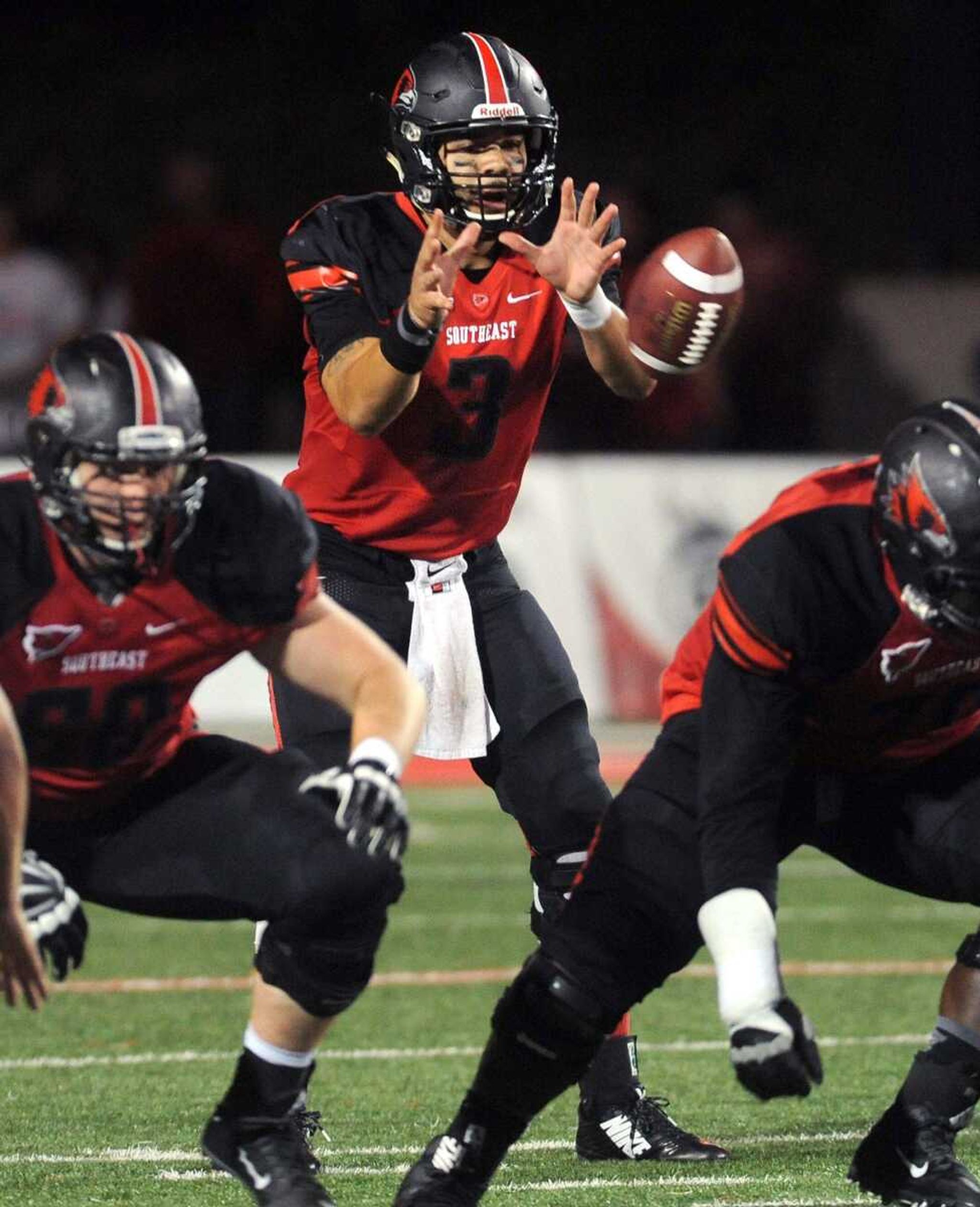 Southeast Missouri State quarterback Tay Bender takes the snap against Southern Illinois during the third quarter Saturday, Sept. 12, 2015 at Houck Stadium. (Fred Lynch)