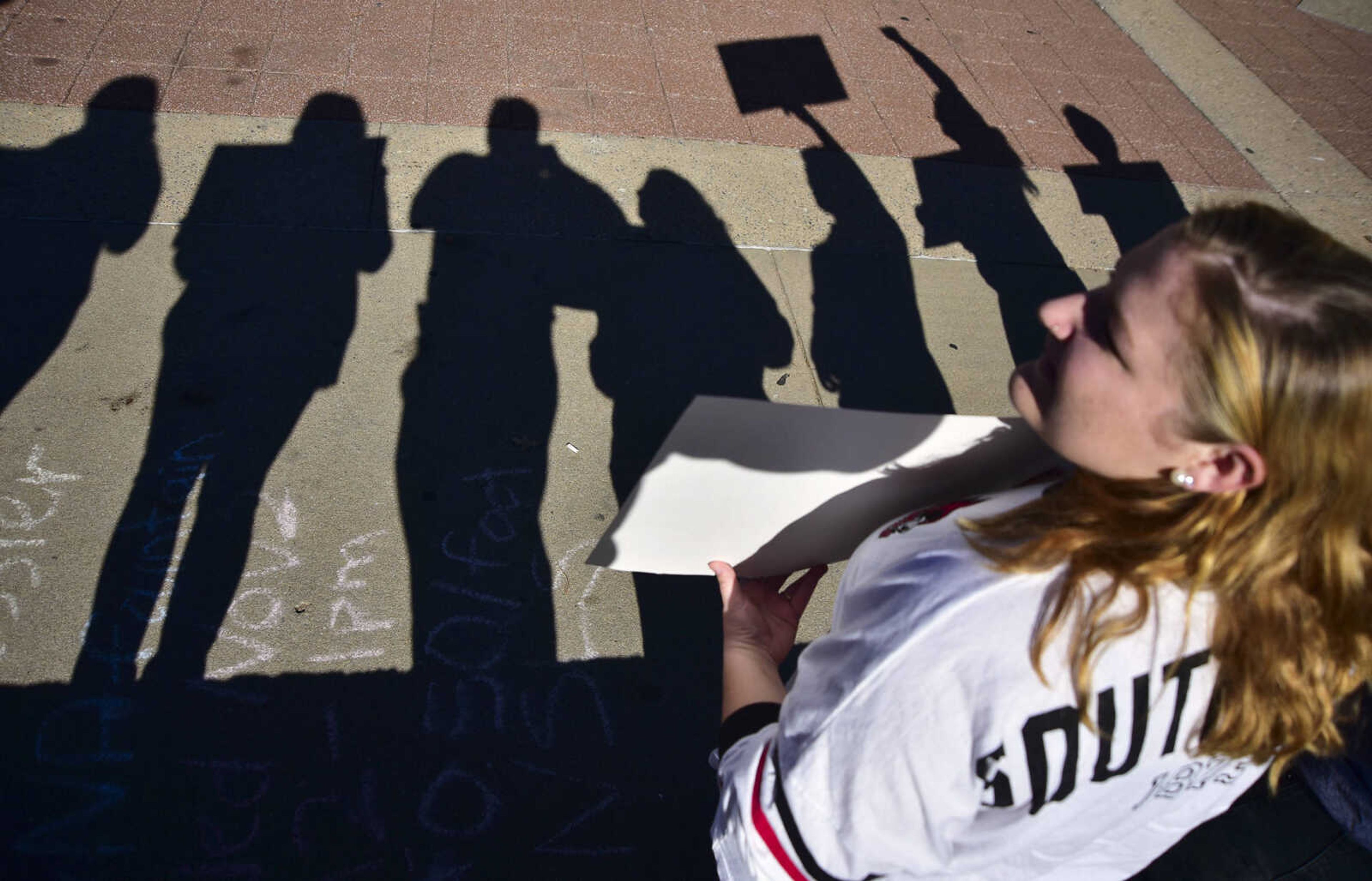 ANDREW J. WHITAKER ~ awhitaker@semissourian.com
Ellen Carr stands with other Southeast Missouri State University students and faculty stand in protest of the election and show others they are not alone Wednesday, Nov. 16, 2016 in front of the Kent Library on SEMO campus in Cape Girardeau.