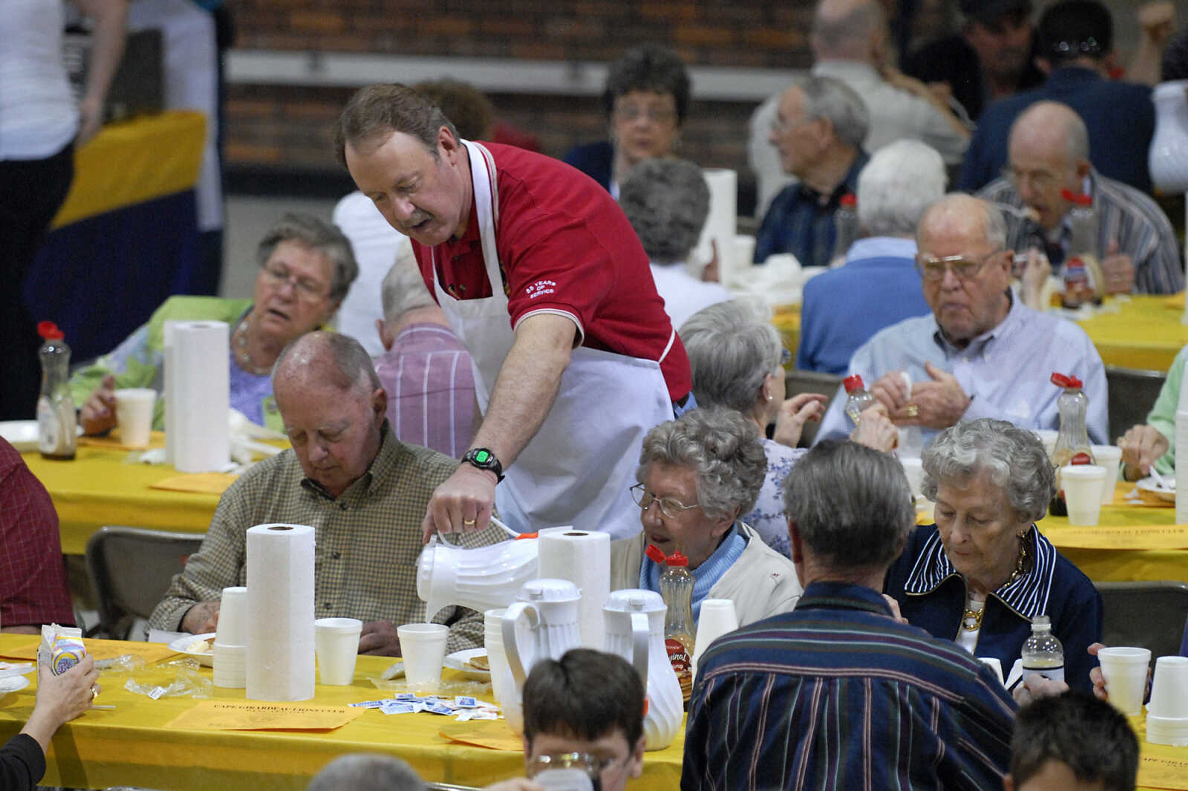 KRISTIN EBERTS ~ keberts@semissourian.com

Mike Unverferth, center, provides coffee refills during the 73rd annual Pancake Day put on by the Cape Lions Club at the A.C. Brase Arena on Wednesday, March 23, 2011, in Cape Girardeau. More than 10,000 pancakes and 700 pounds of sausage were served.