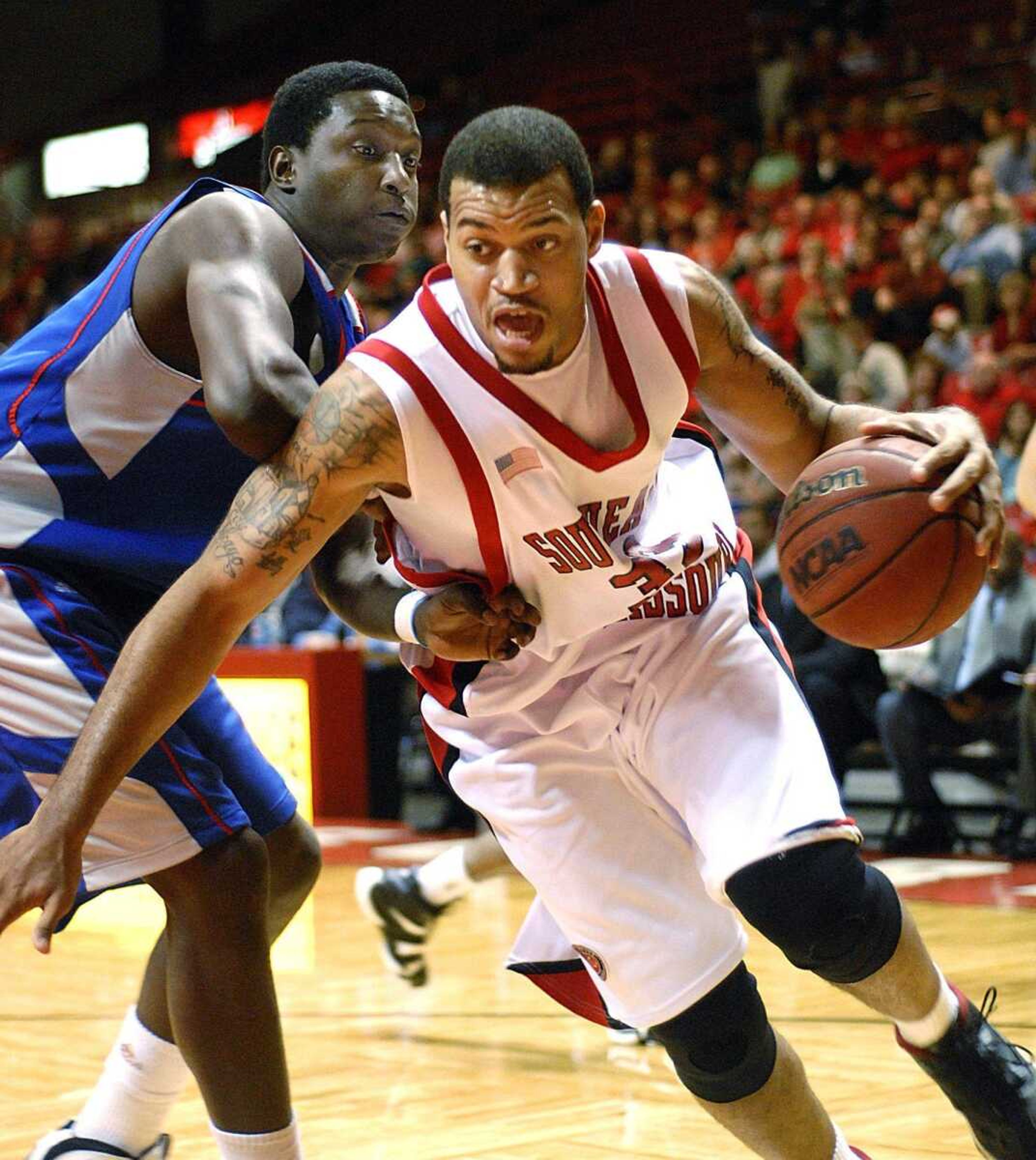 Southeast Missouri State's Michael Rembert drove against Tennessee State's Dontrell Taylor during the first half Thursday at the Show Me Center. (Aaron Eisenhauer)