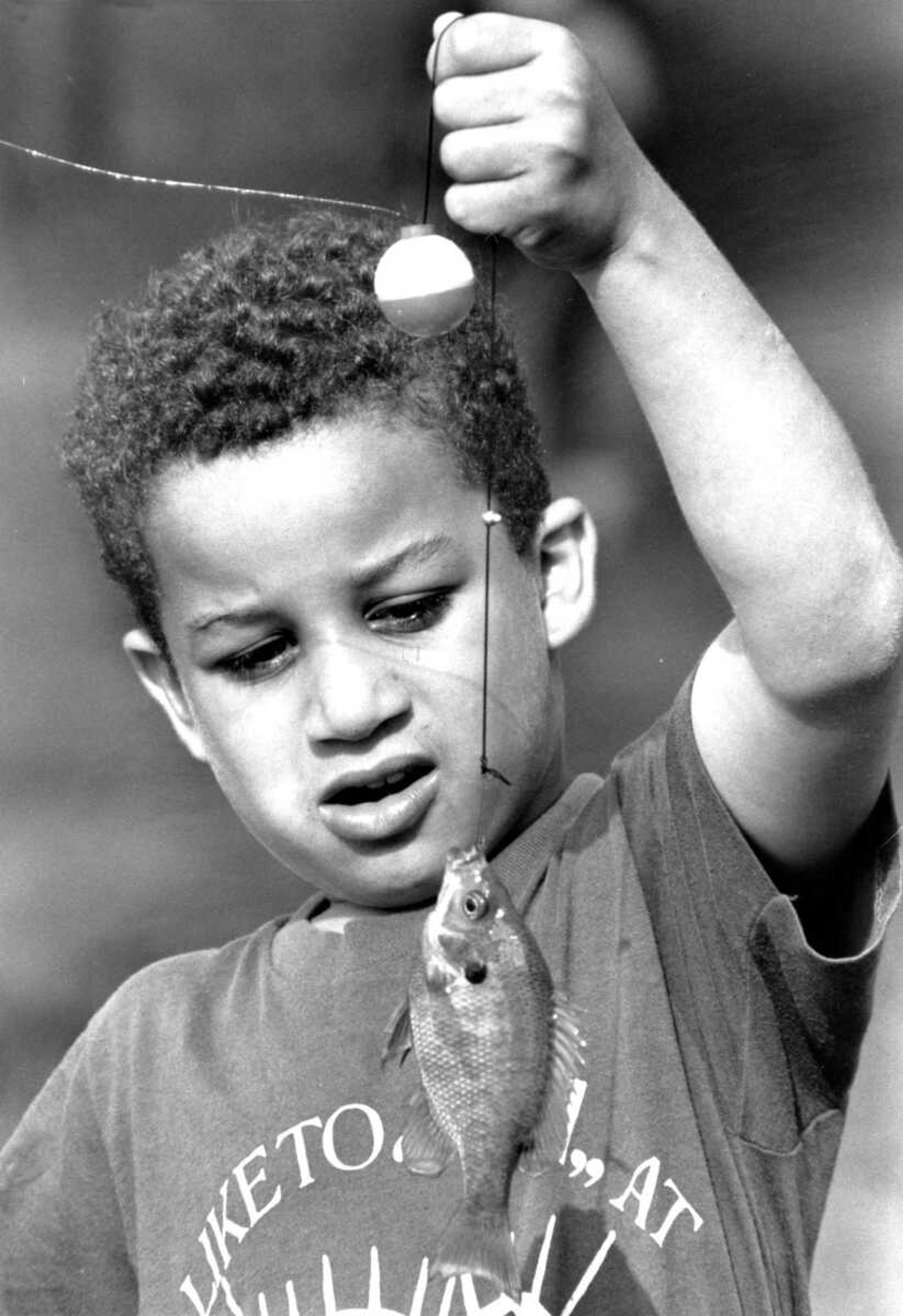 Published April 29, 1991.
Chris Johnston of Cape Girardeau admired the bluegill that he caught at Capaha Park Lagoon. He used corn for bait. (Southeast Missourian archive)