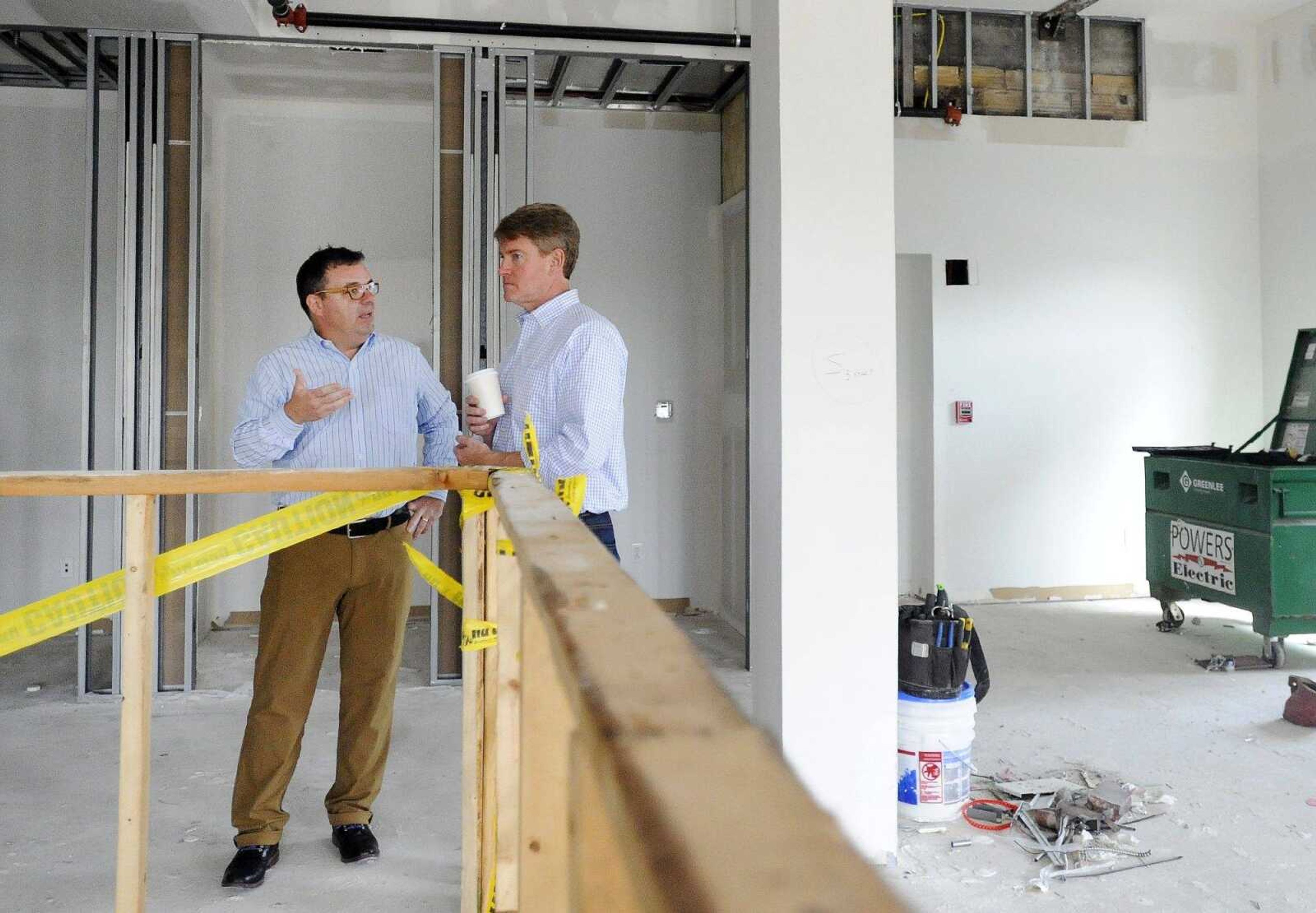 James Stapleton, left, a founding member of Codefi, speaks with Missouri Attorney General Chris Koster during a tour of the Marquette Tower on Thursday in Cape Girardeau.