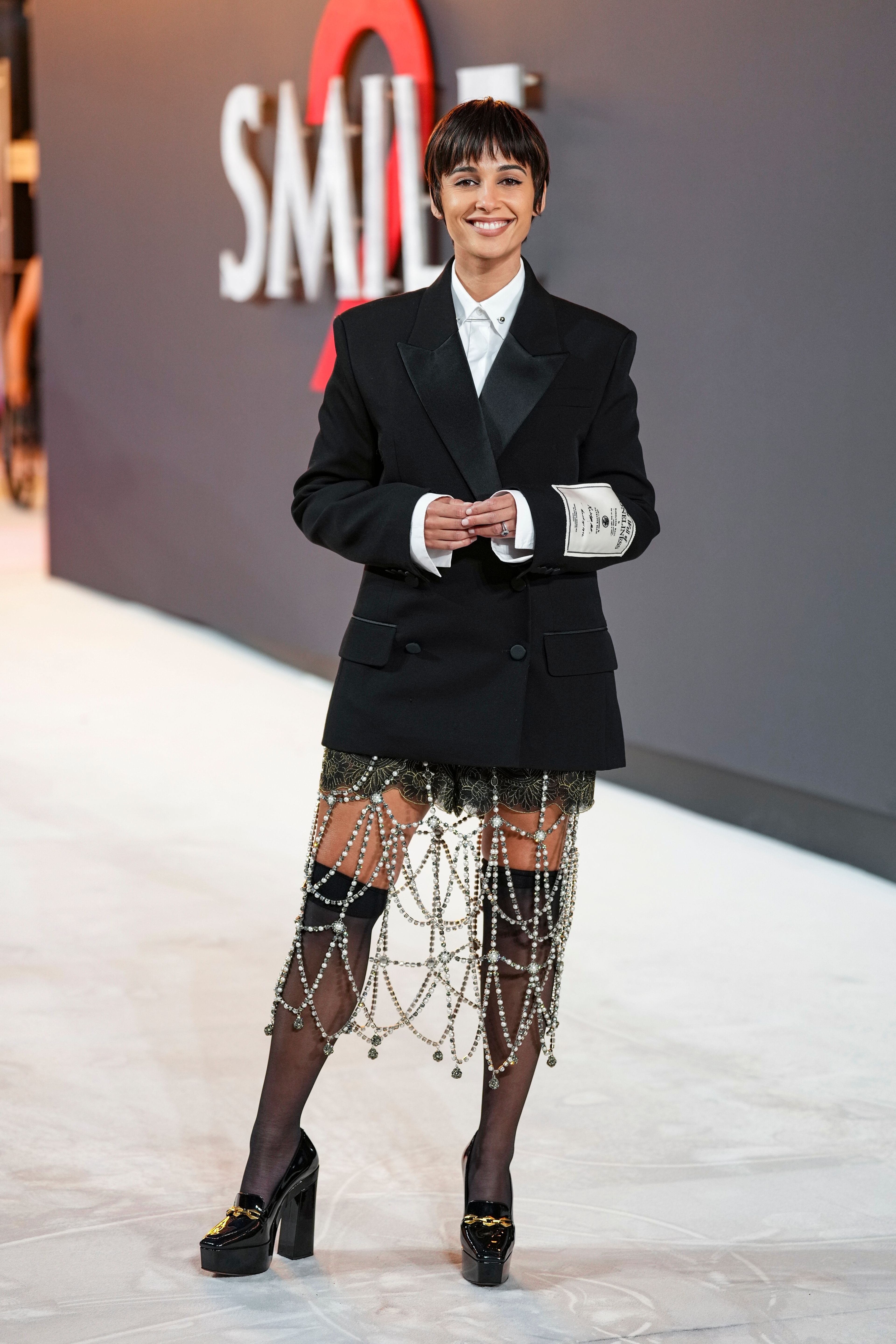 Naomi Scott poses for photographers upon arrival at the premiere for the film 'Smile 2' on Tuesday, Oct. 8, 2024, in London. (Photo by Scott A Garfitt/Invision/AP)