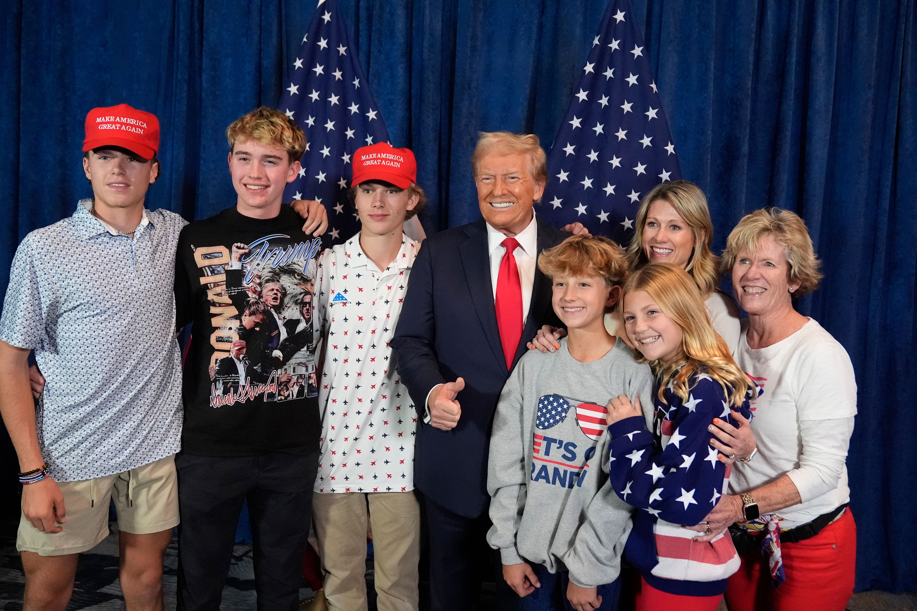 Republican presidential nominee former President Donald Trump poses for a photo before he speaks at a campaign rally at the Gaylord Rockies Resort & Convention Center, Friday, Oct. 11, 2024, in Aurora, Colo. (AP Photo/Alex Brandon)