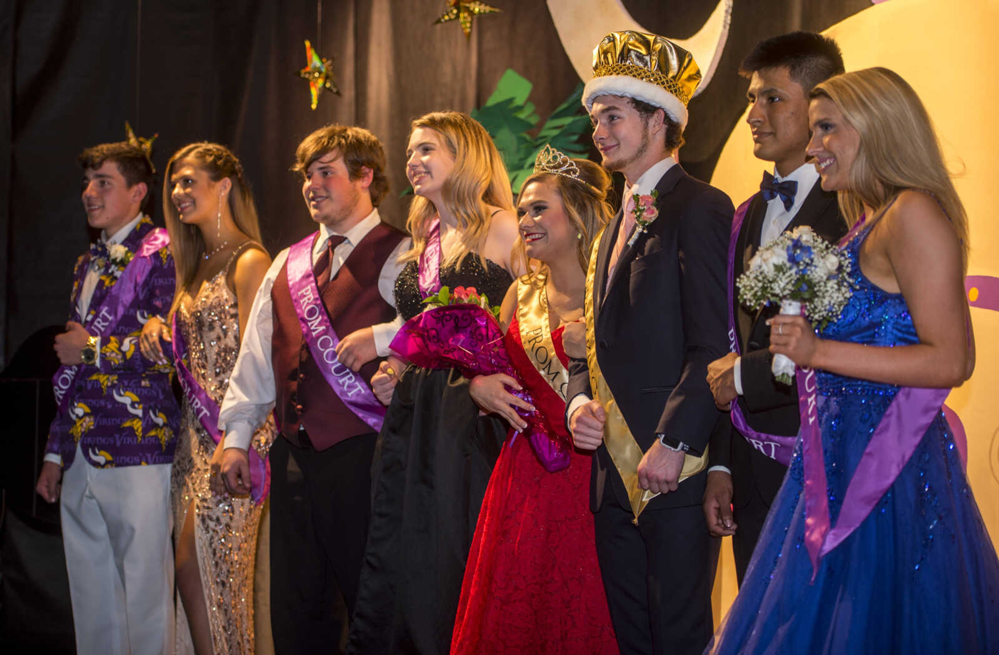 The prom court, from left, Christian Worley, Reagan Swain, Gavin Childers, Abby Hupp, Lauren Lambert, Tyler Wolf, Louis Logeman and Mallory Poat pose for photos during prom Saturday, April 6, 2019, at Kelly High School in Benton. 
Lambert and Wolf were named Prom Queen and King, respectively.