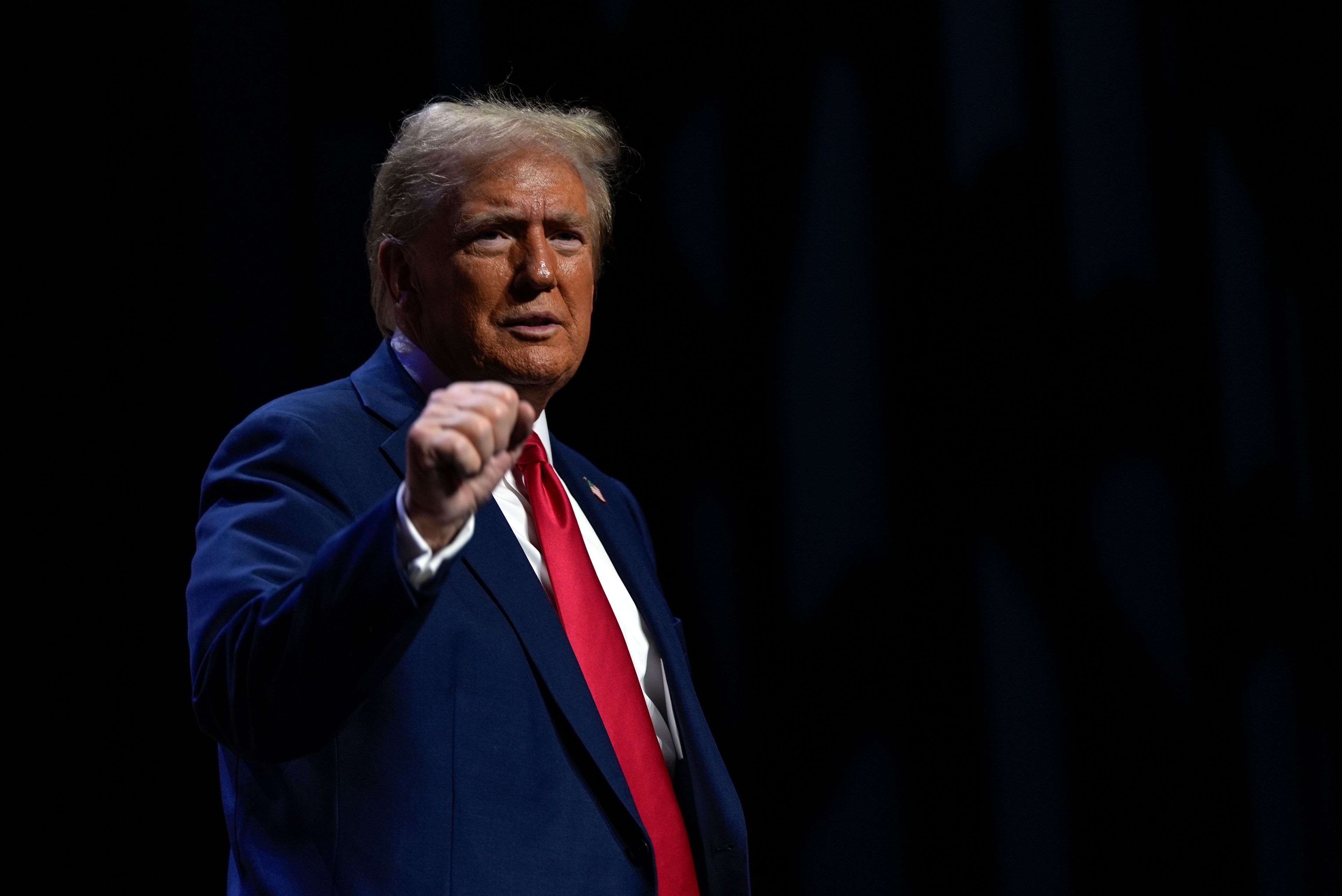 Republican presidential nominee former President Donald Trump departs a meeting of the Detroit Economic Club, Thursday, Oct. 10, 2024, in Detroit. (AP Photo/Julia Demaree Nikhinson)