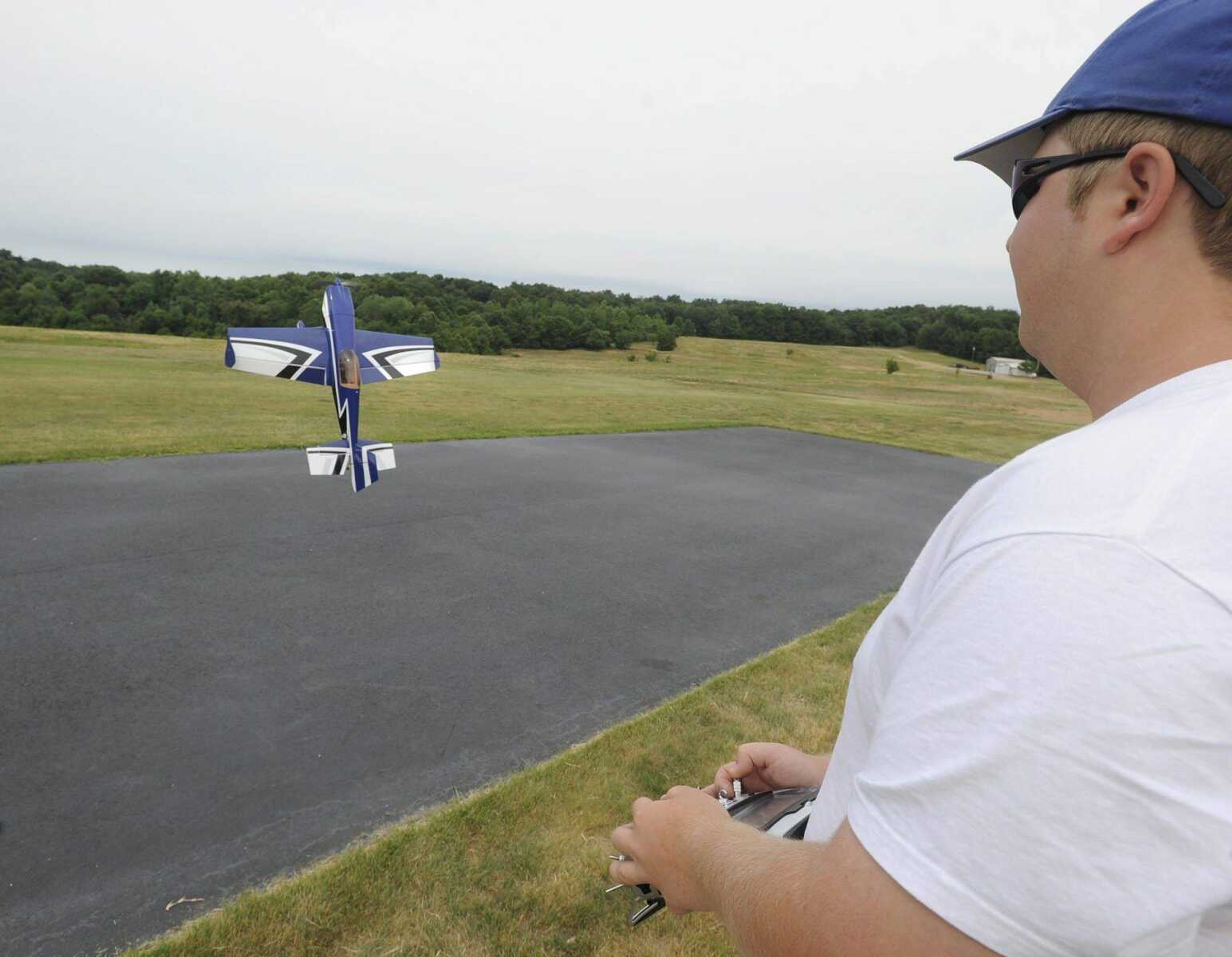 Joe Smith of Fort Wayne, Ind., pilots his electric 3D Hobby Shop aerobatic plane Thursday at Galaxy Park. The Fly-Low-In event continues through Sunday. (Fred Lynch)