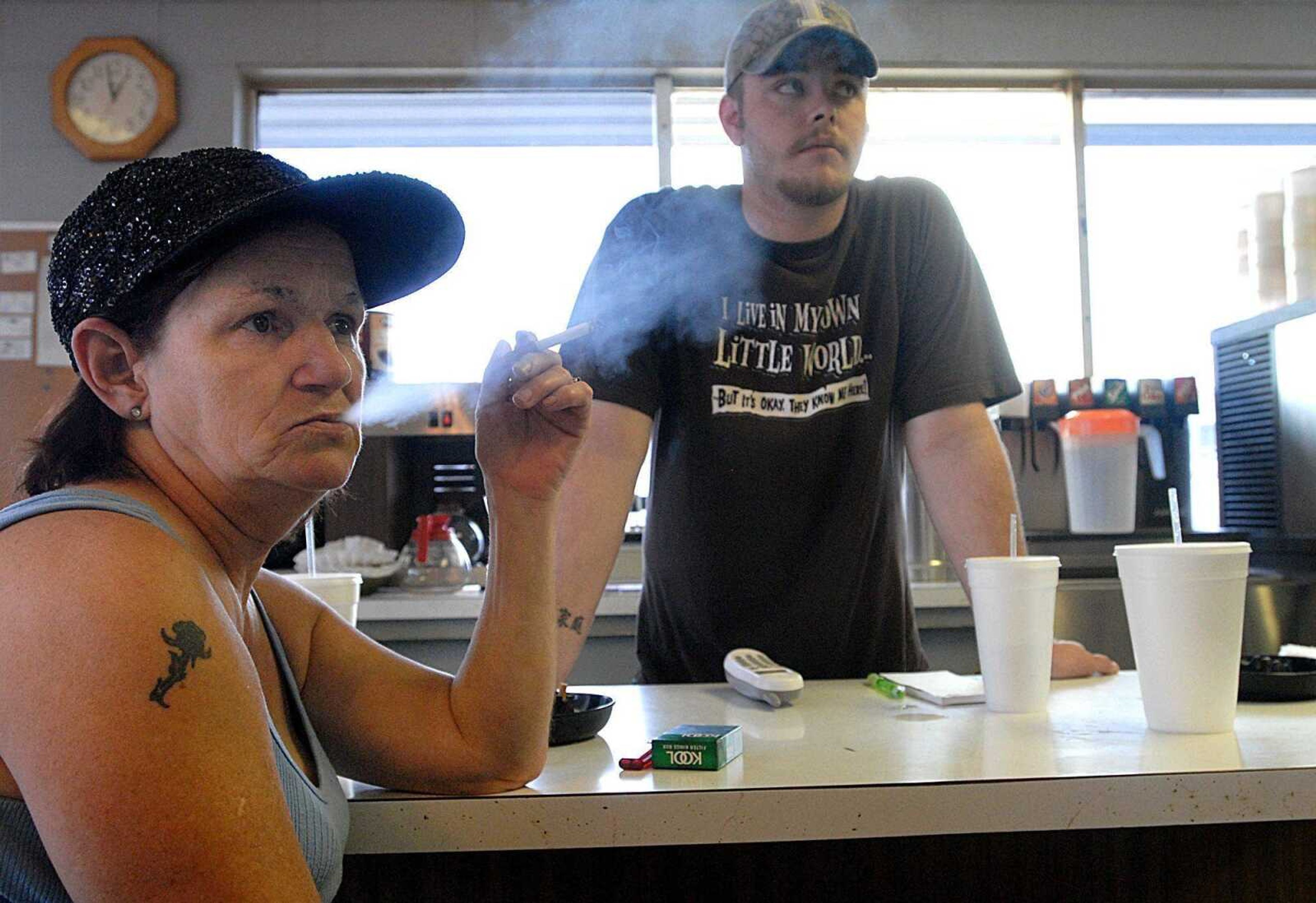 Darlene Beasley smoked in July while working at Nonny's in Cairo, Ill. In January, all Illinois public places will be smoke-free. (Aaron Eisenhauer)