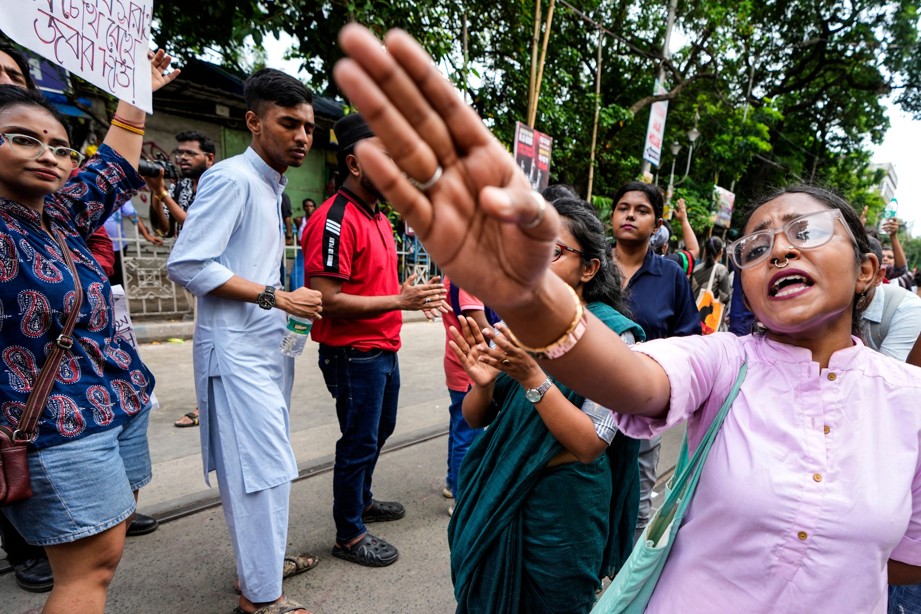 A woman shouts slogans as she joins a rally to protest against the rape and murder of a resident doctor at a government hospital in August, in Kolkata, India, Sunday, Sept. 1, 2024. (AP Photo/Bikas Das)