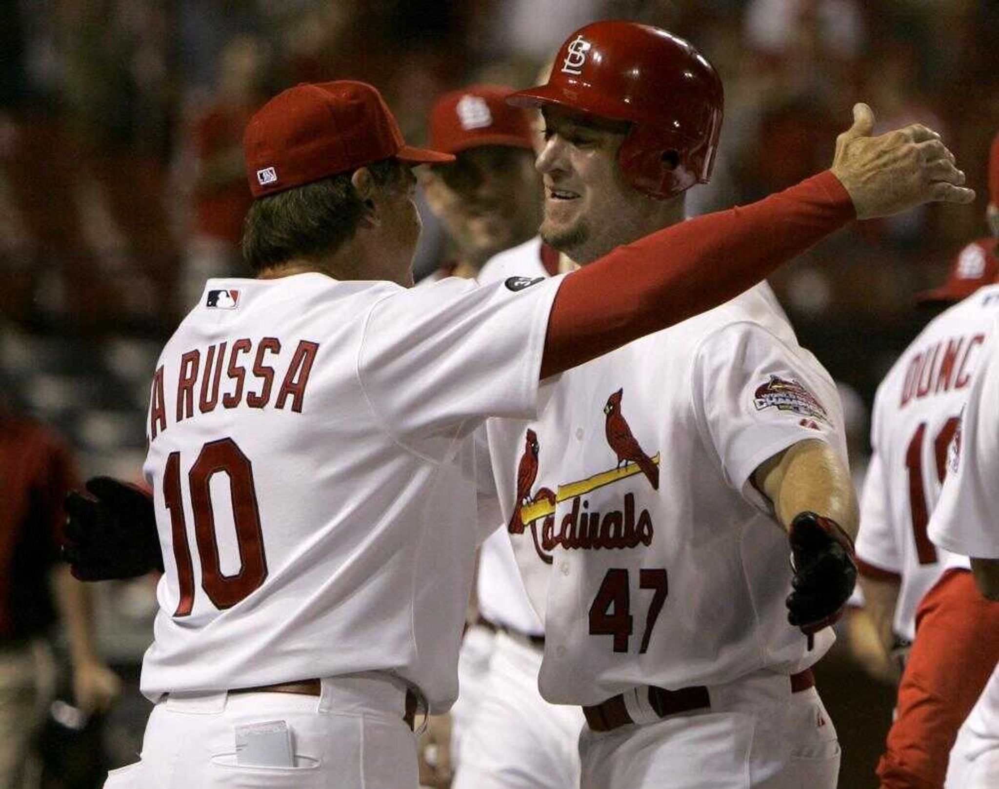 St. Louis Cardinals outfielder Ryan Ludwick, right, got a hug from manager Tony La Russa after hitting a home run to defeat the Kansas City Royals early today in St. Louis.