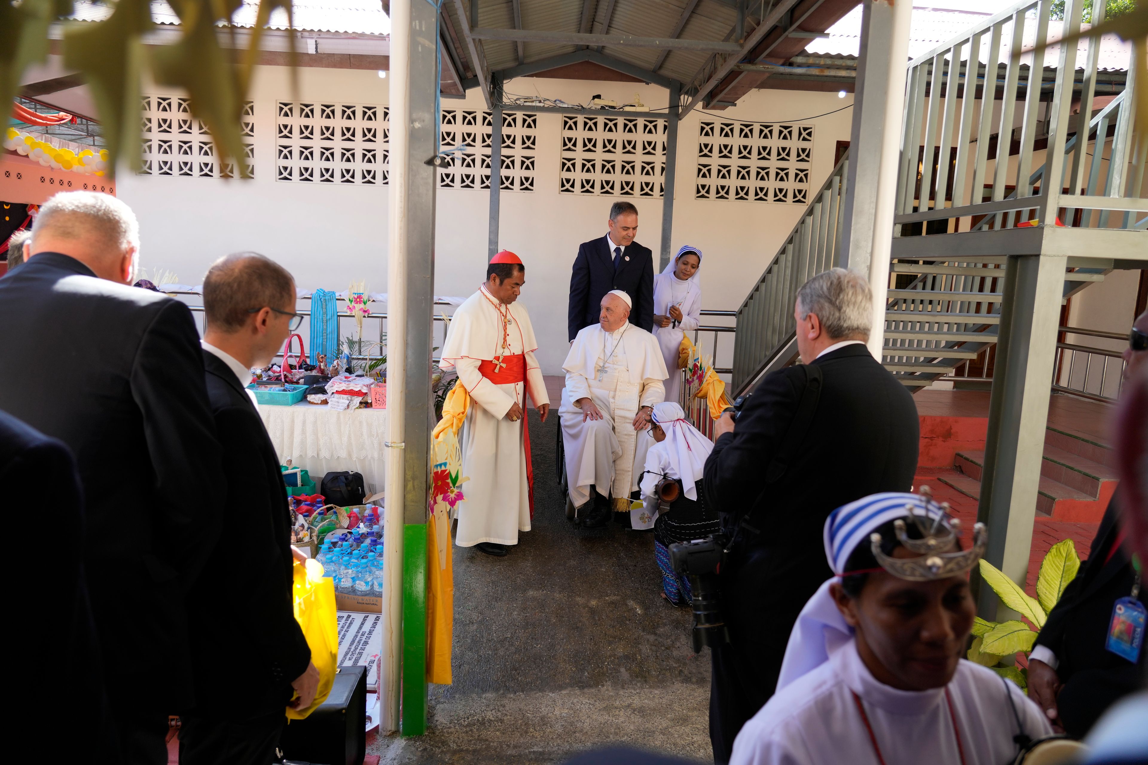 Pope Francis arrives at the 'Irmas ALMA' (Sisters of the Association of Lay Missionaries) School for Children with Disabilities in Dili, East Timor, Tuesday, Sept. 10, 2024. Pope Francis has indirectly acknowledged the abuse scandal in East Timor involving its Nobel Peace Prize-winning independence hero Bishop Carlos Filipe Ximenes Belo. "Let us also not forget that these children and adolescents have their dignity violated," Francis said. "In response, we are all called to do everything possible to prevent every kind of abuse and guarantee a healthy and peaceful childhood for all young people." (AP Photo/Gregorio Borgia)