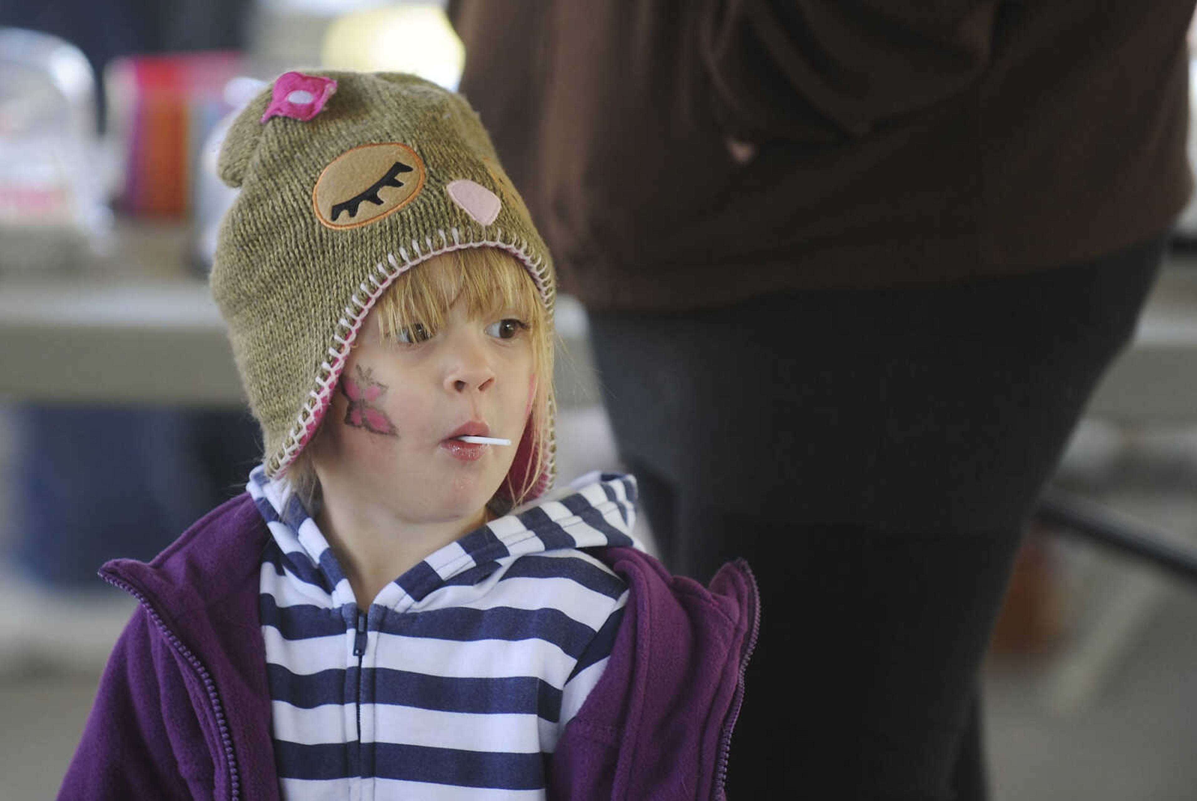 Brooklyn Minner, 2, goes around the cake walk during the Morley Fall Festival Saturday, October 6, in Morley.