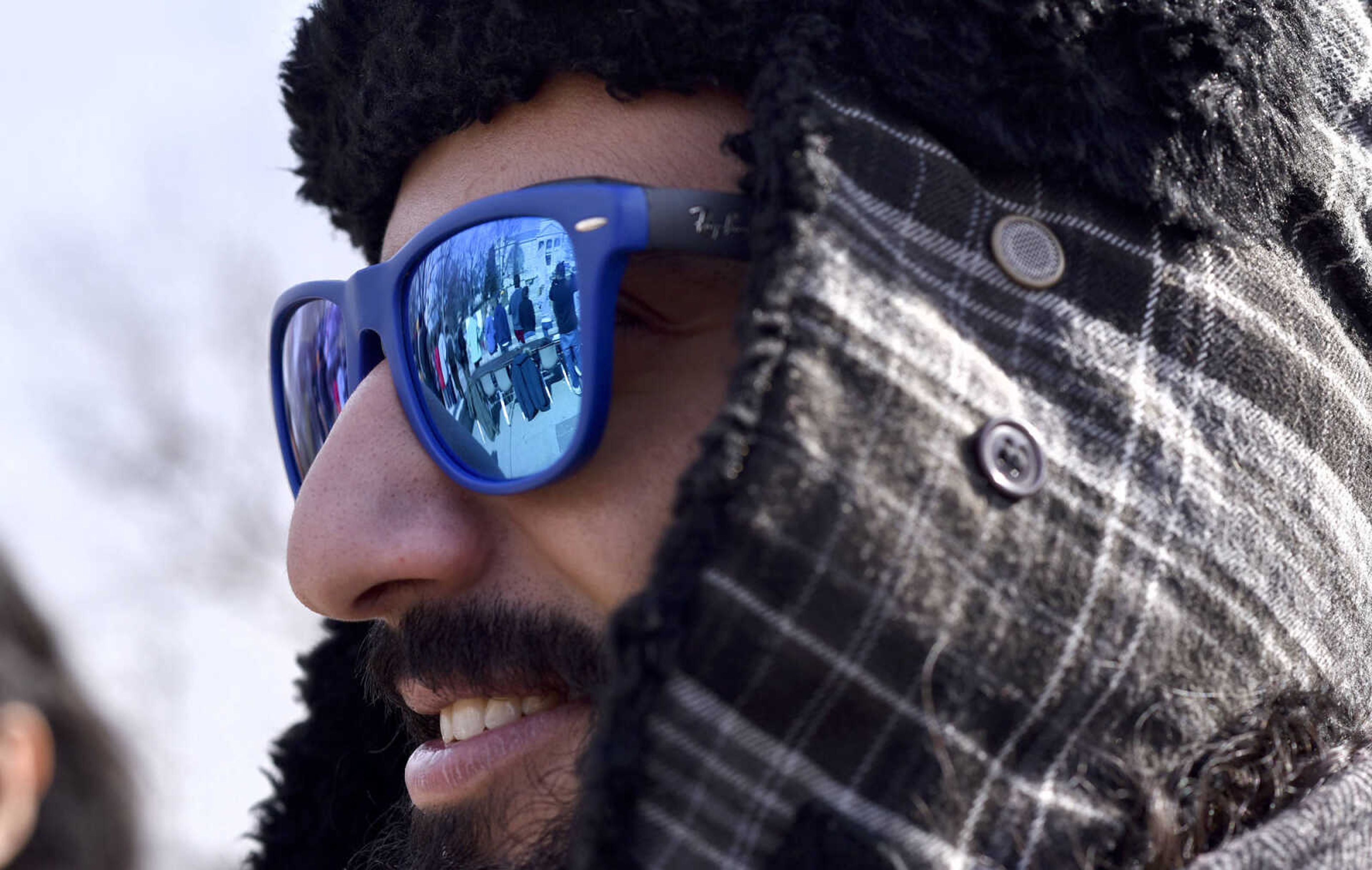 LAURA SIMON ~ lsimon@semissourian.com

Protestors are reflected in Abdullah Bin Muqbil's sunglasses during a human rights protest on Wednesday, Feb. 1, 2017, outside Southeast Missouri State University's Kent Library in Cape Girardeau. Around 60 students participated in the protest.