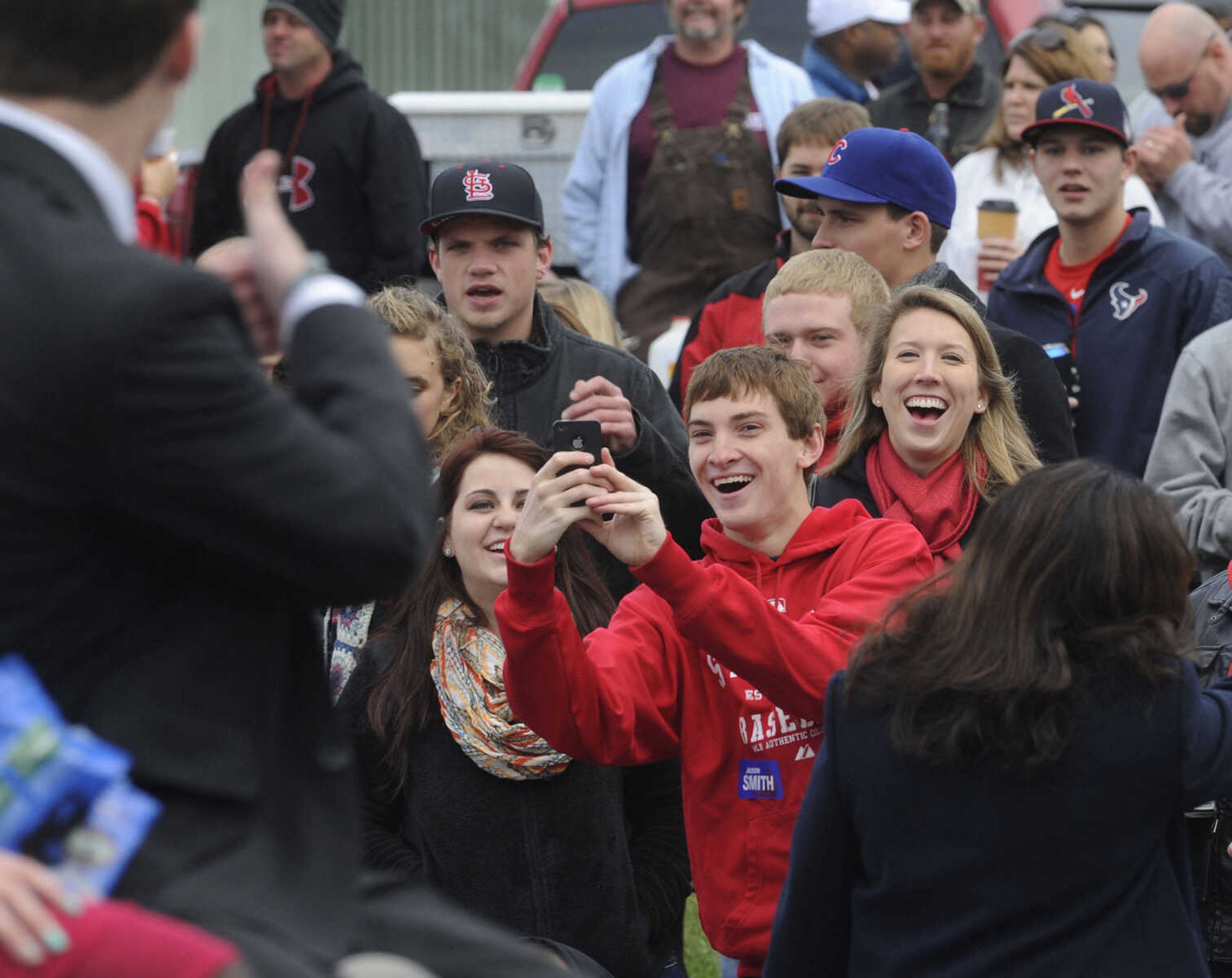 The crowd connects with the SEMO Homecoming parade Saturday, Oct. 26, 2013 on Broadway in Cape Girardeau.