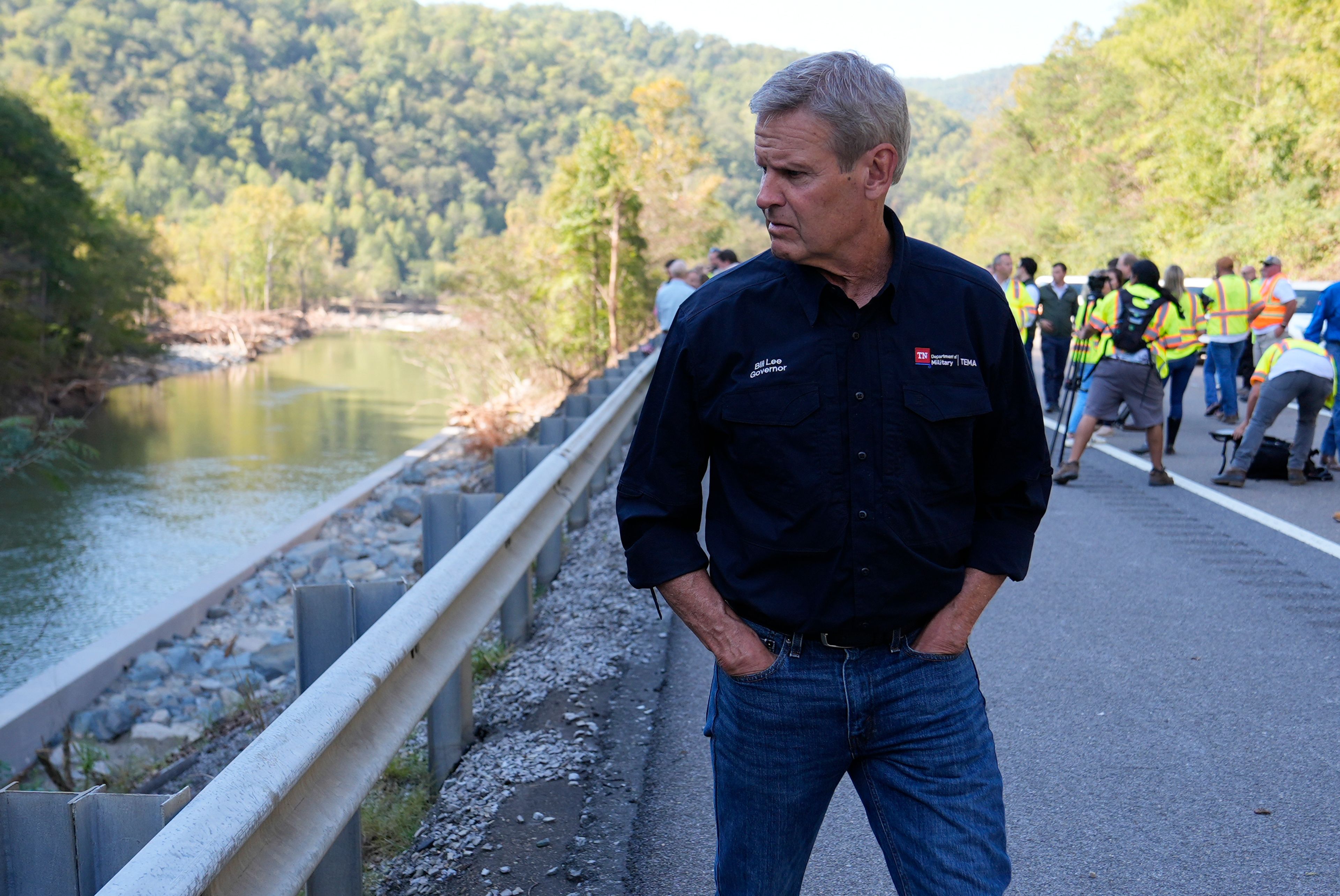 Tennessee Gov. Bill Lee surveys the damage from Hurricane Helene along Interstate 40 near the North Carolina state line Monday, Oct. 7, 2024, in Cocke County, Tenn. (AP Photo/George Walker IV via Pool)