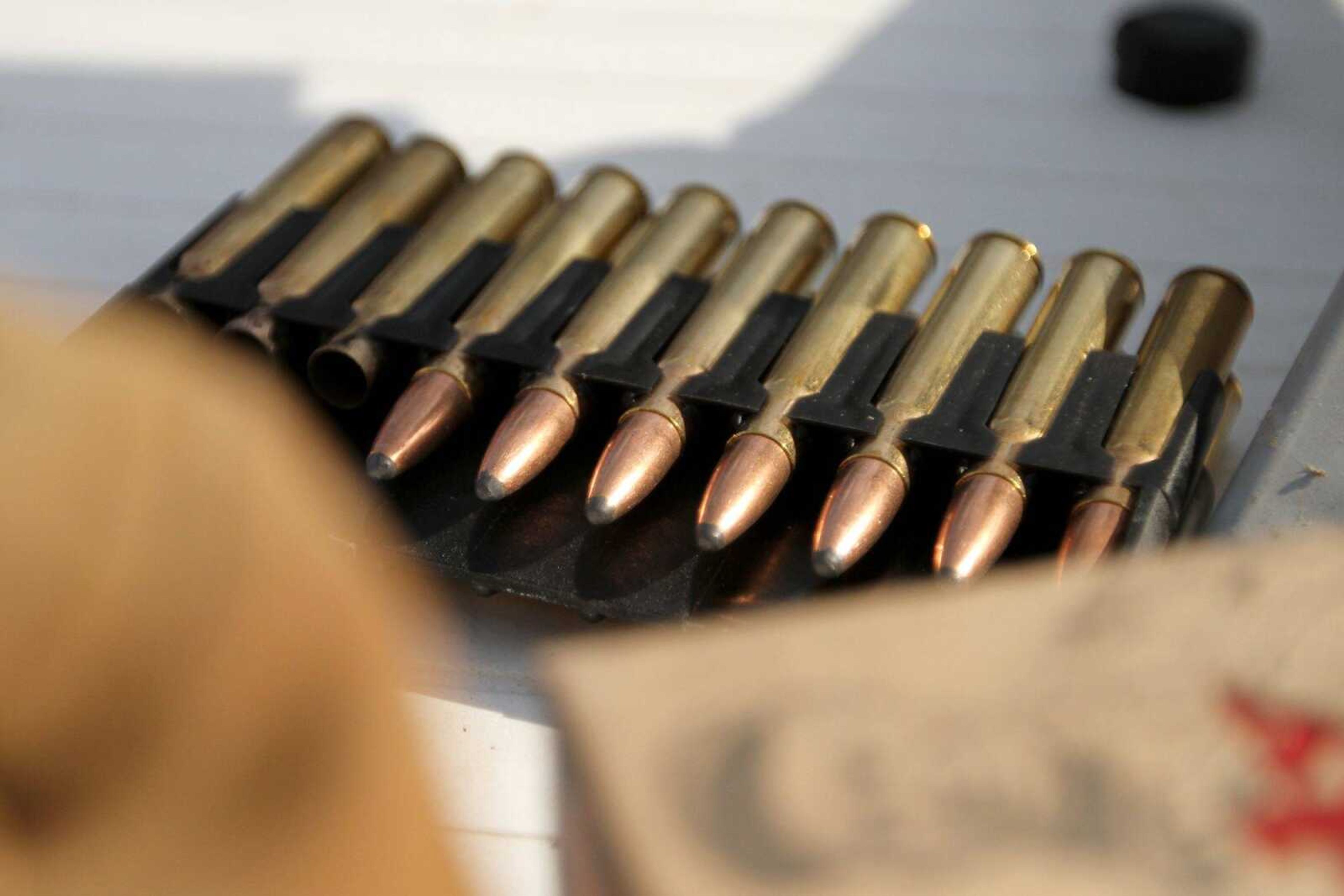 Bullets rest on a table Saturday where Seth Koehler sights in his deer-hunting rifle. (Glenn Landberg)