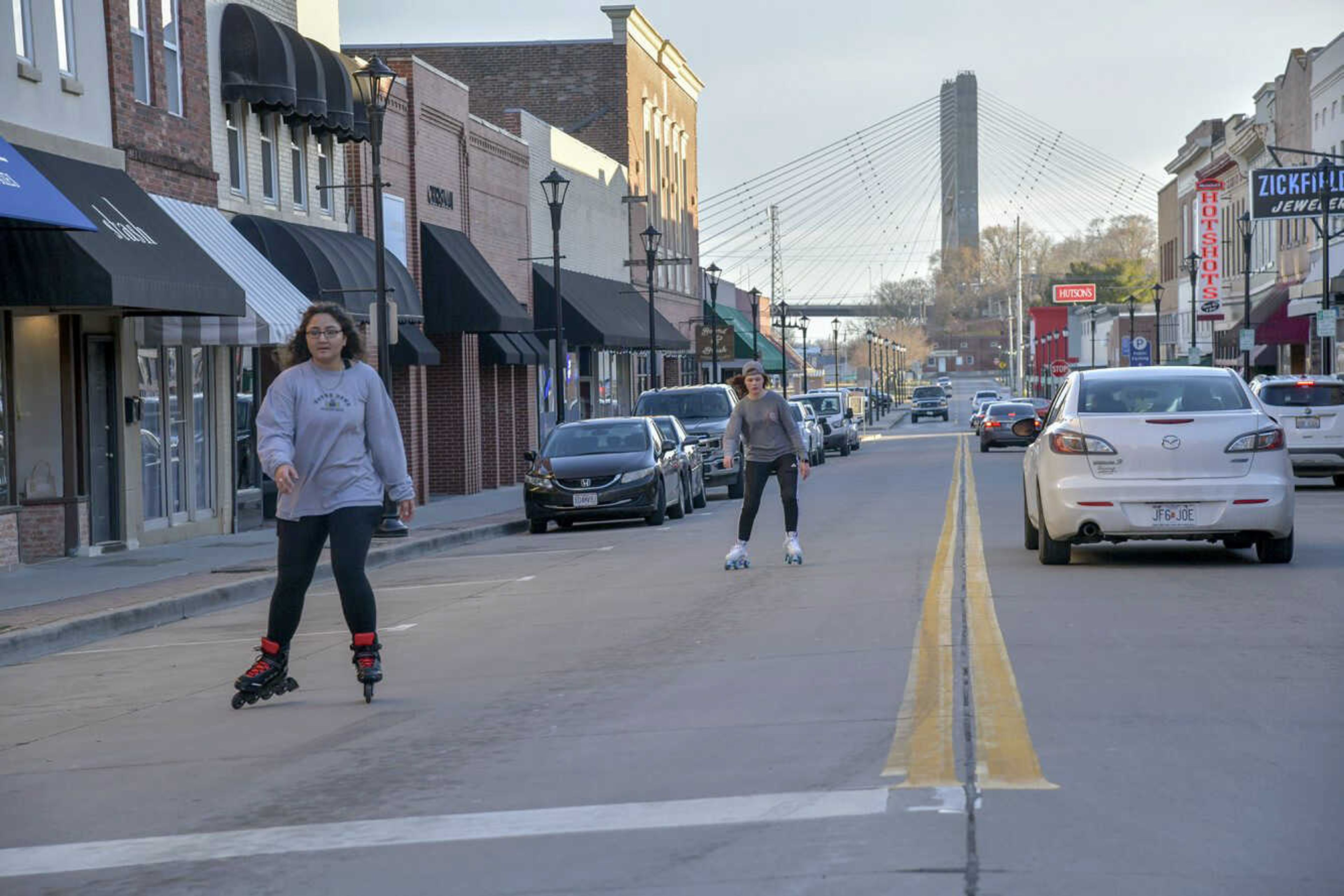 Shamina Sadiqullah, left, and Alyssa Boyd skate along Main Street on Monday in downtown Cape Girardeau.