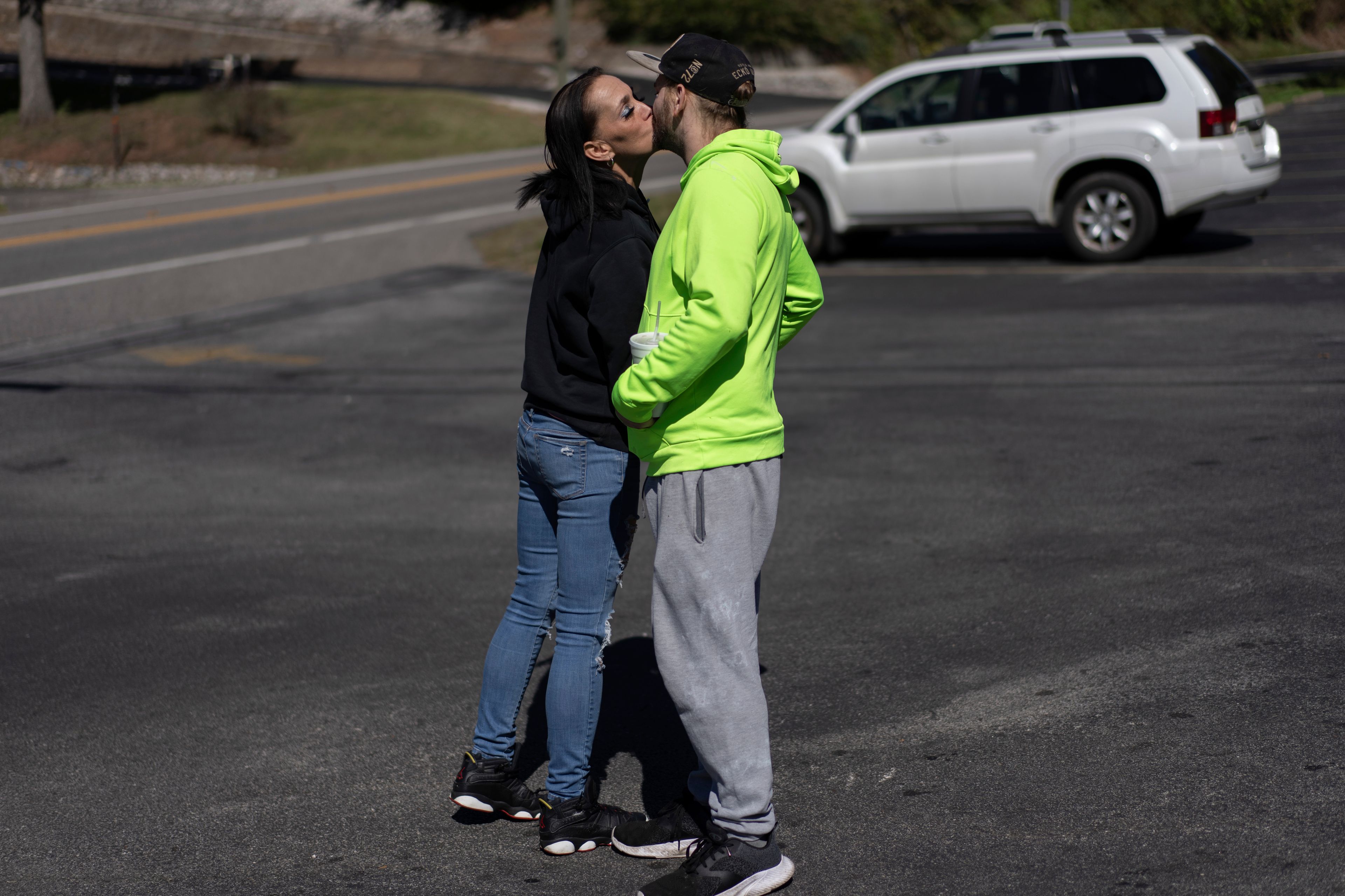 April Youst kisses Aaron Parsons in the parking lot before starting work at a restaurant in West Virginia on Wednesday, Oct. 9, 2024. (AP Photo/Carolyn Kaster)