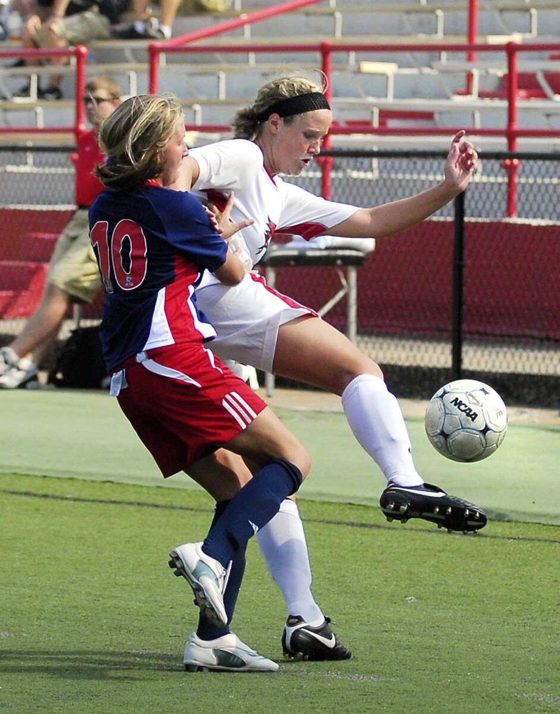 Southeast Missouri State's Ali Bauer staves off Belmont defender Amy Jo Anderson Sunday, August 22, 2010 at Houck Stadium. (Laura Simon)