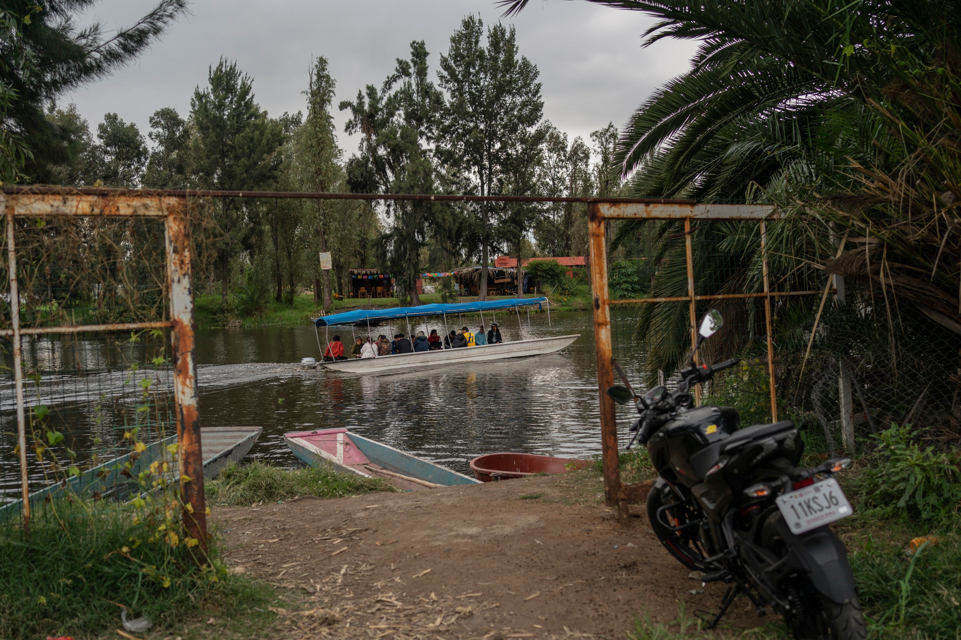 Amateur soccer players travel in a traditional canoe in the Xochimilco borough of Mexico City on Sunday, October 20, 2024. (AP Photo/Felix Marquez)