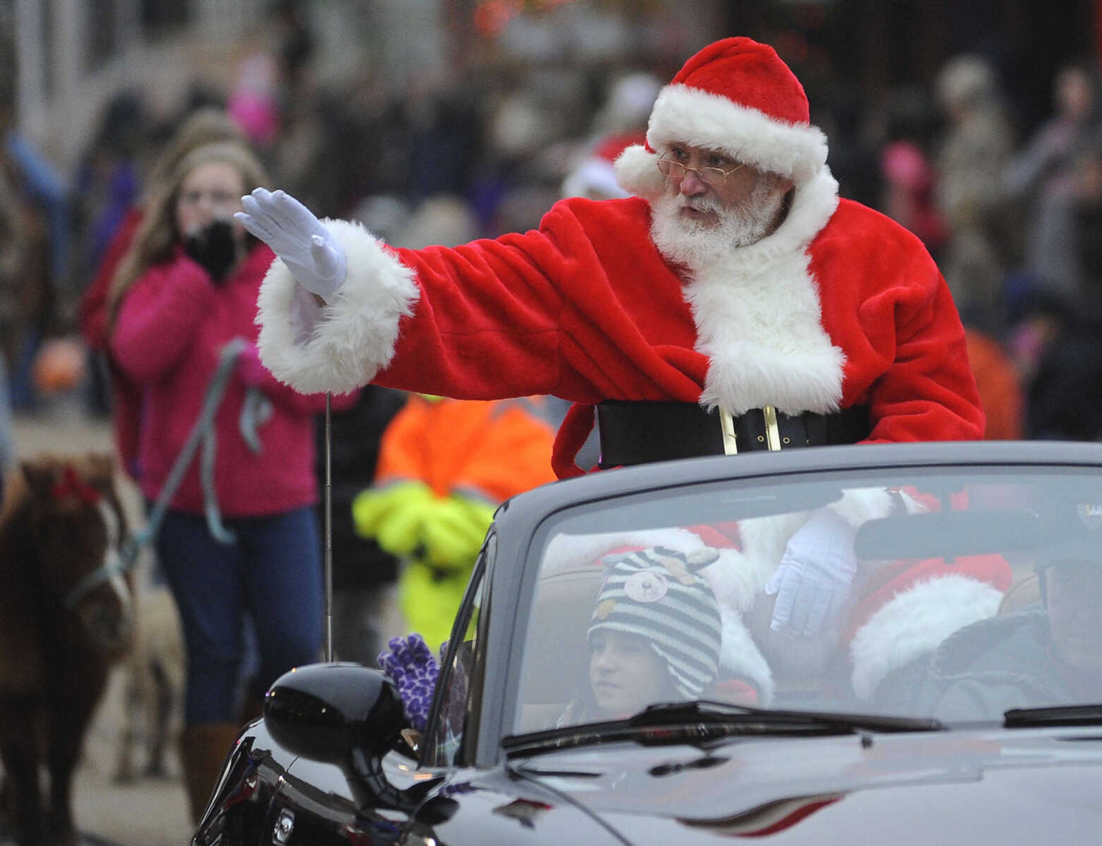 Santa Claus appears at the end of the Jackson Christmas parade Saturday, Dec. 6, 2014 in Jackson.