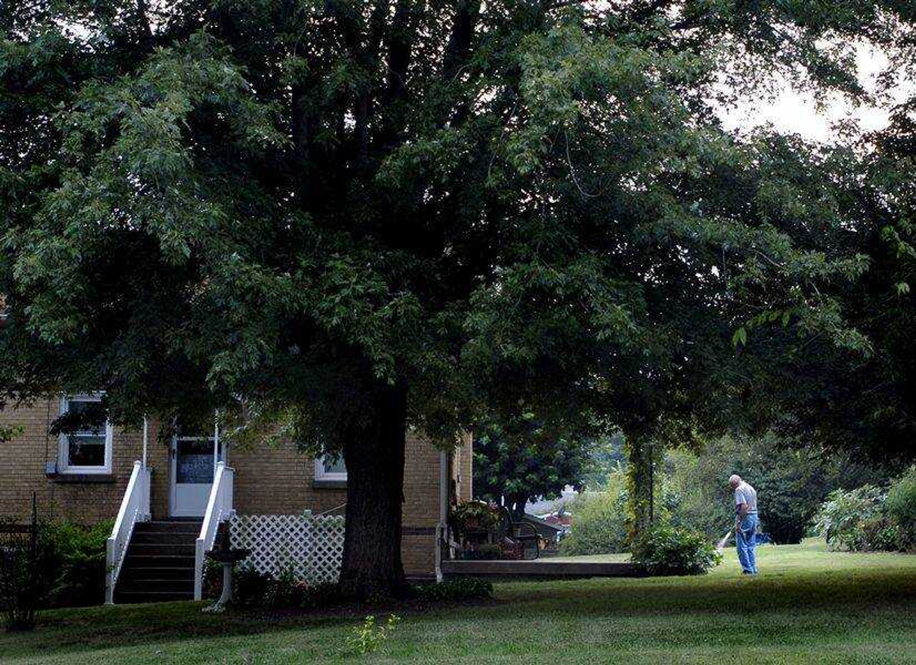 AARON EISENHAUER ~ aeisenhauer@semissourian.com
Wib Reisenbichler watered plants in the backyard of his Pocahontas home on Tuesday evening.  Reisenbichler has lived in the town for just over 50 years.