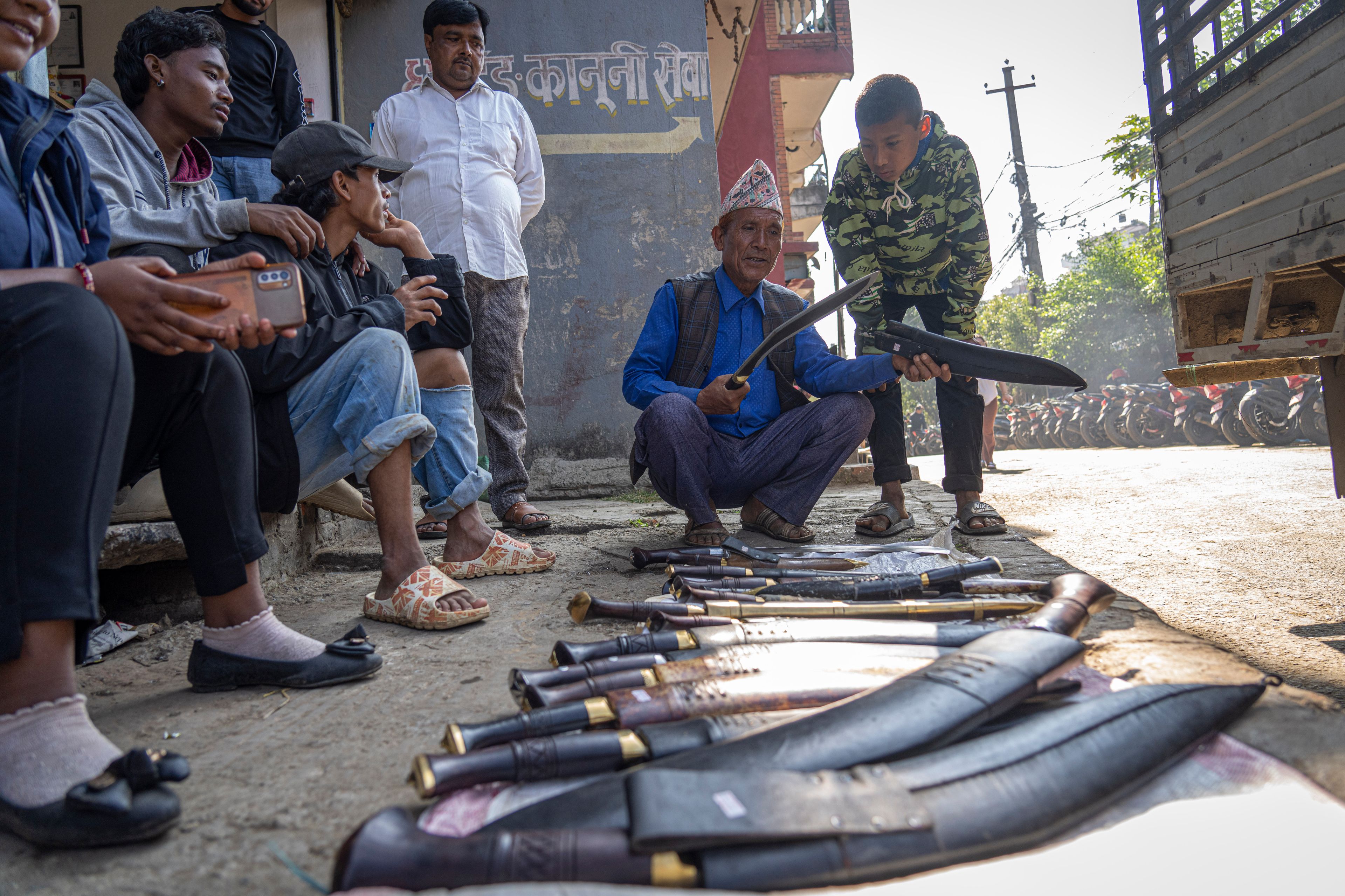 A customer looks for a blade to purchase for use in animal sacrifice during Dashain festival in Kathmandu, Nepal, Friday, Oct. 11, 2024. The festival commemorates the slaying of a demon king by Hindu goddess Durga, marking the victory of good over evil. (AP Photo/Niranjan Shrestha)