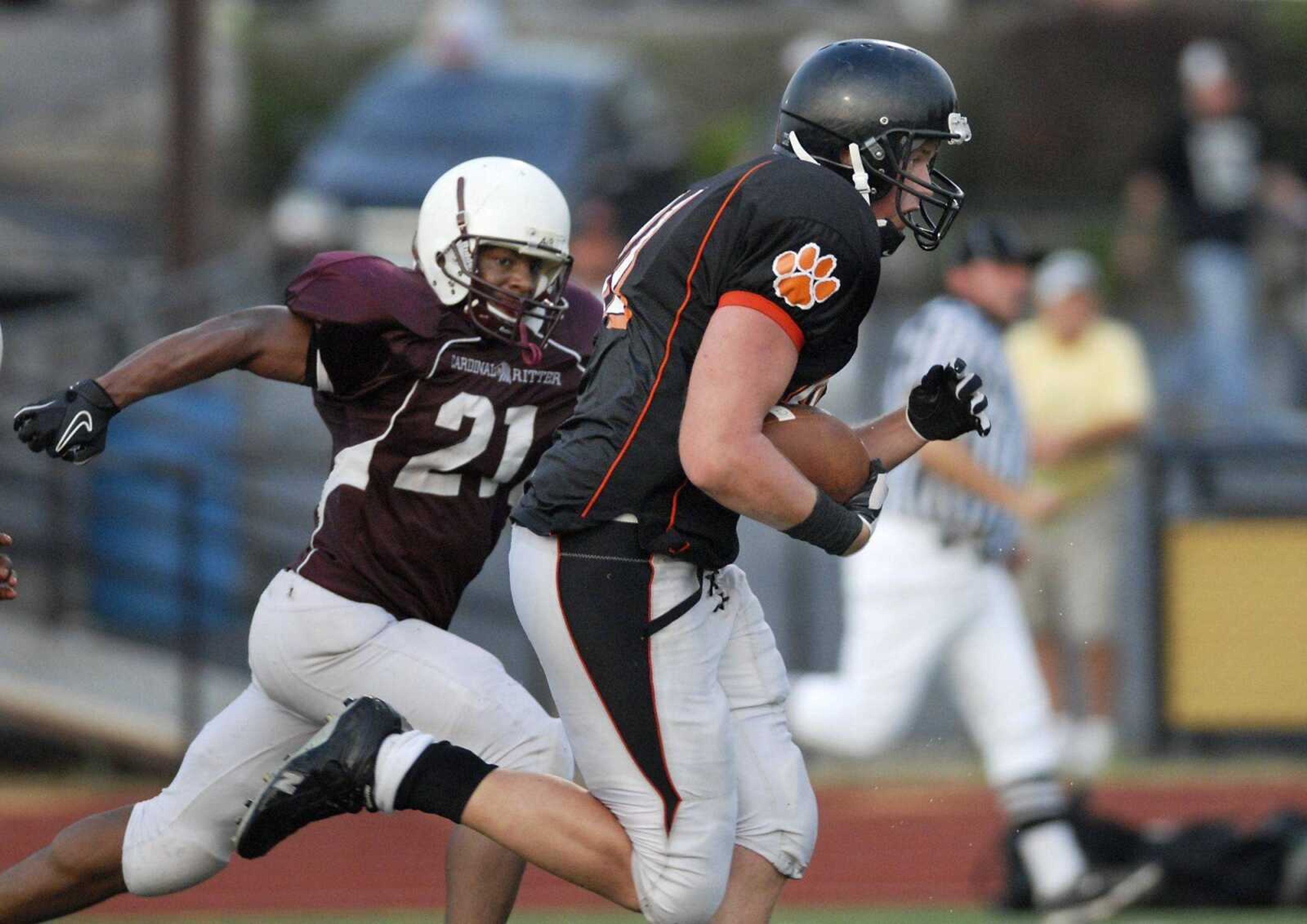 Central senior tight end Zach Boerboom runs into the end zone as Cardinal Ritter 's John Edwards pursues him during Friday's jamboree at Farmington High School in Farmington, Mo. (Kristin Eberts)