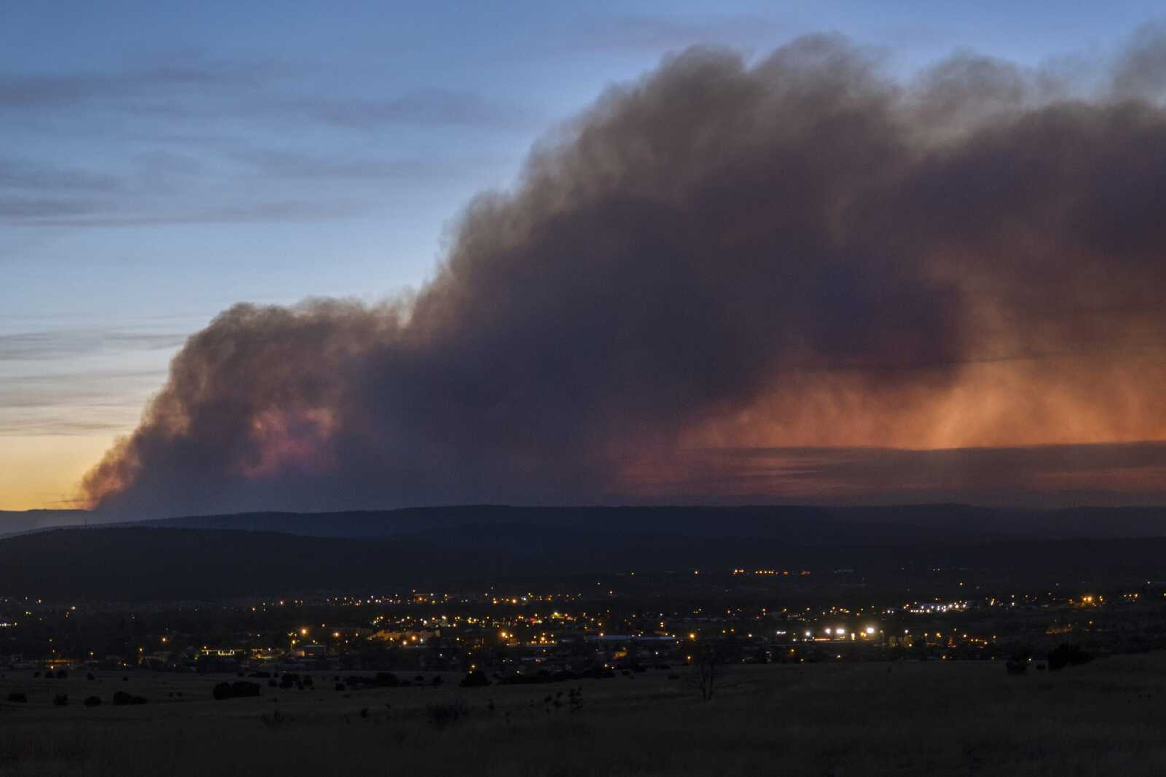 Smoke from the Calf Canyon/Hermits Peak Fire drifts over Las Vegas, New Mexico, on Saturday.