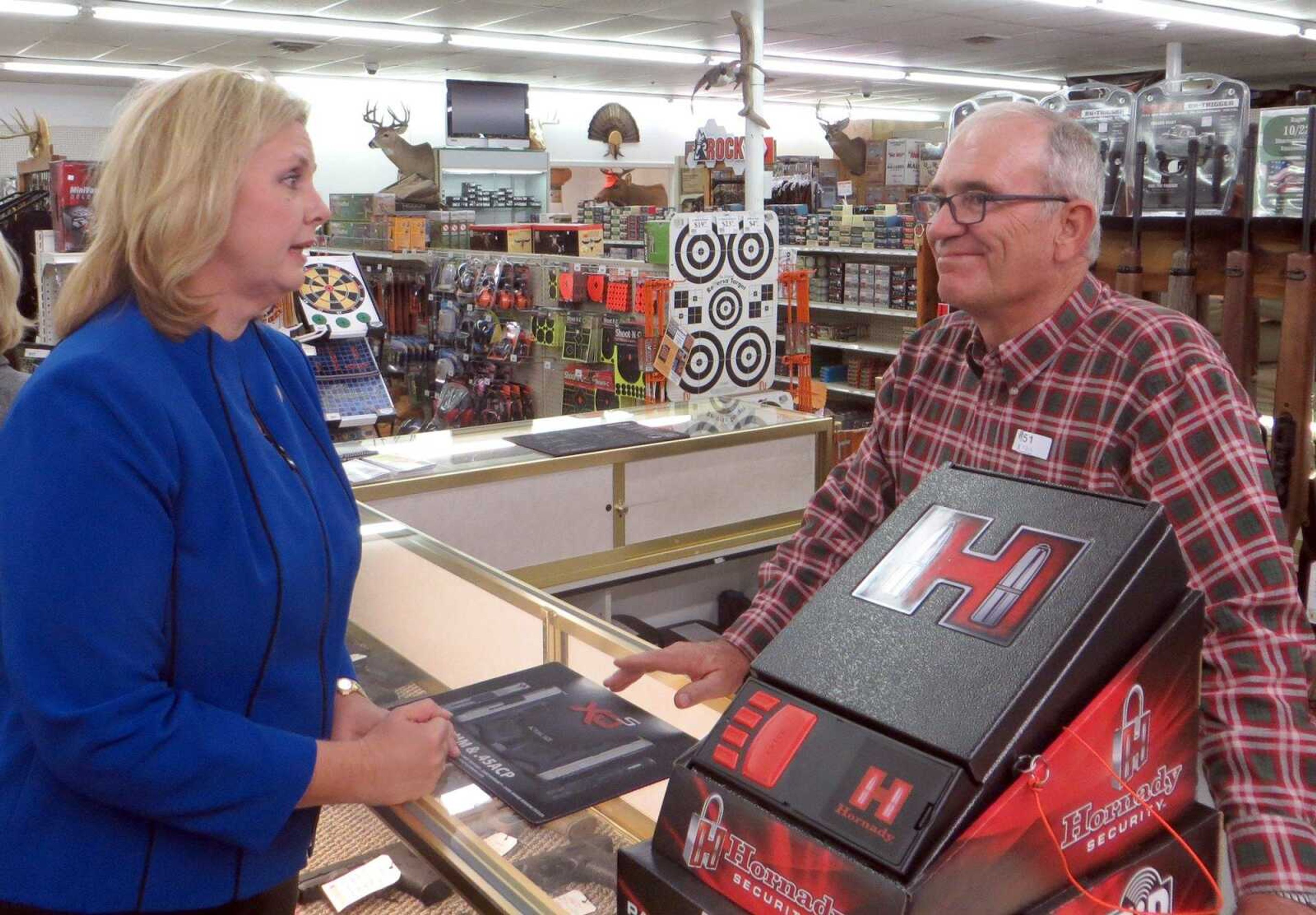 Republican gubernatorial candidate Catherine Hanaway speaks with store co-owner David Lange on Friday at Shooters Gun Shop in Cape Girardeau. (Tyler Graef)