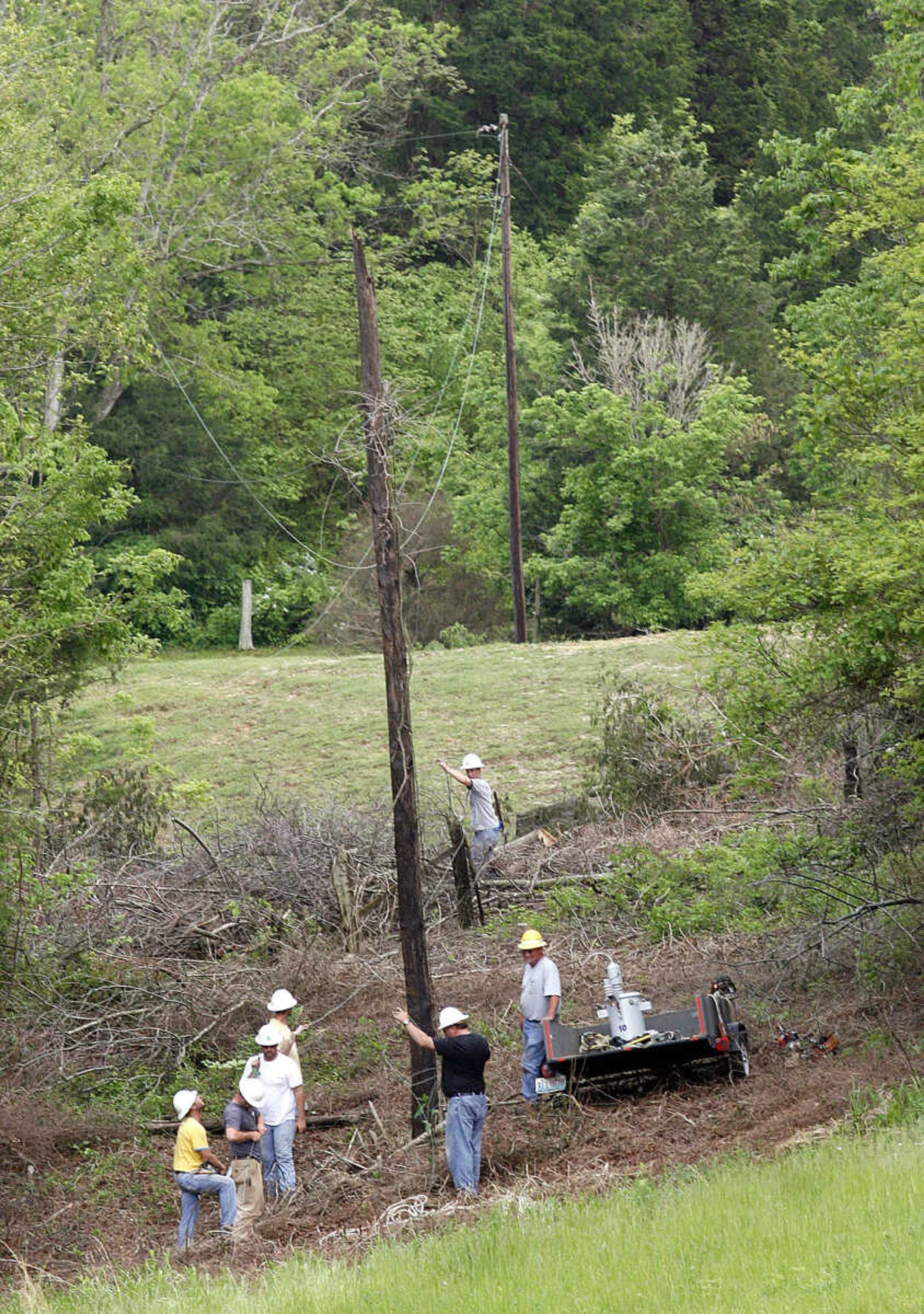 ELIZABETH DODD ~ edodd@semissourian.com
Electricians with Craighead Electric Cooperative work on powerlines in Altenburg.