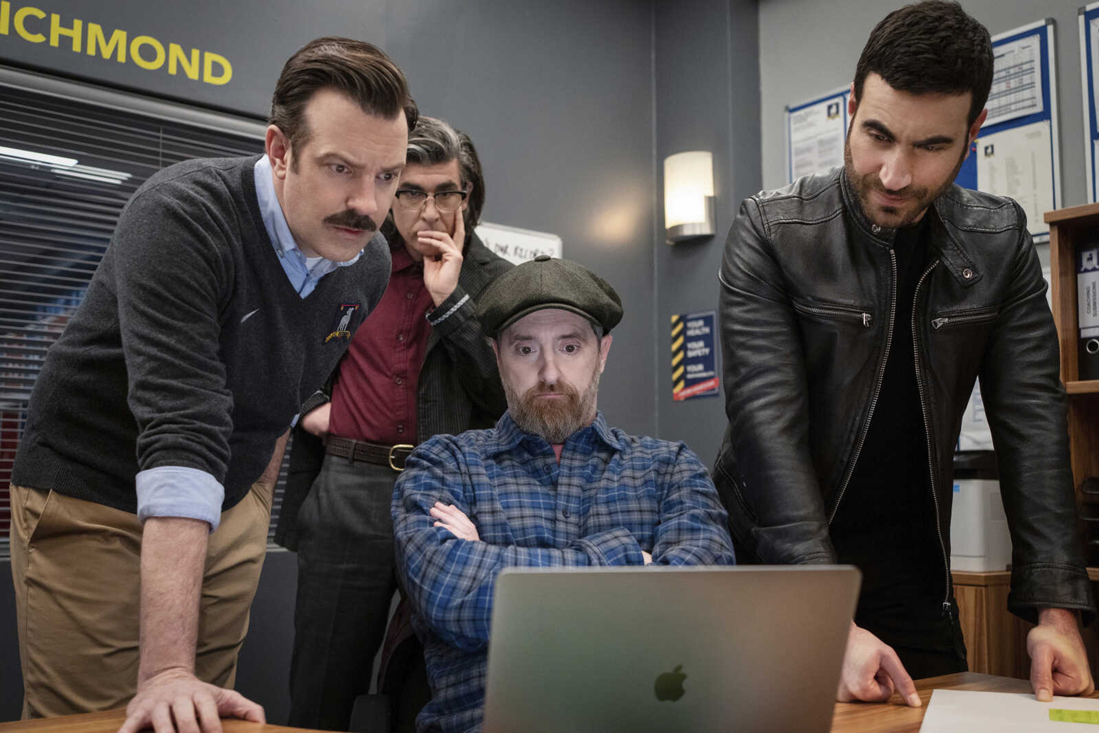 Jason Sudeikis, left, James Lance, Brendan Hunt and Brett Goldstein in a scene from "Ted Lasso".