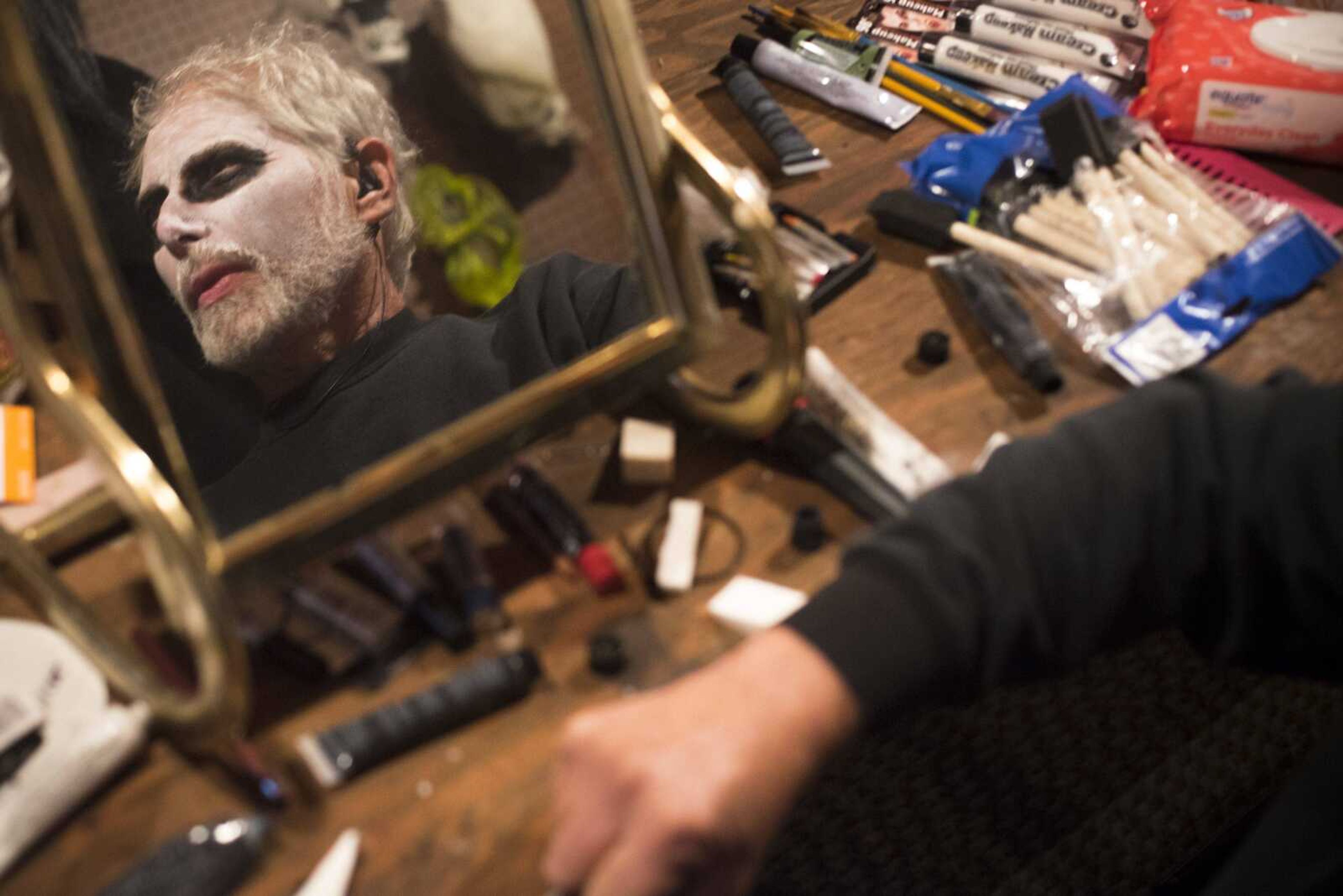 Black Forest owner Greg Macke has his face painted on Friday, Oct. 12, 2018, before serving as one of the Black Forest Haunted Ghost Town grim reapers.