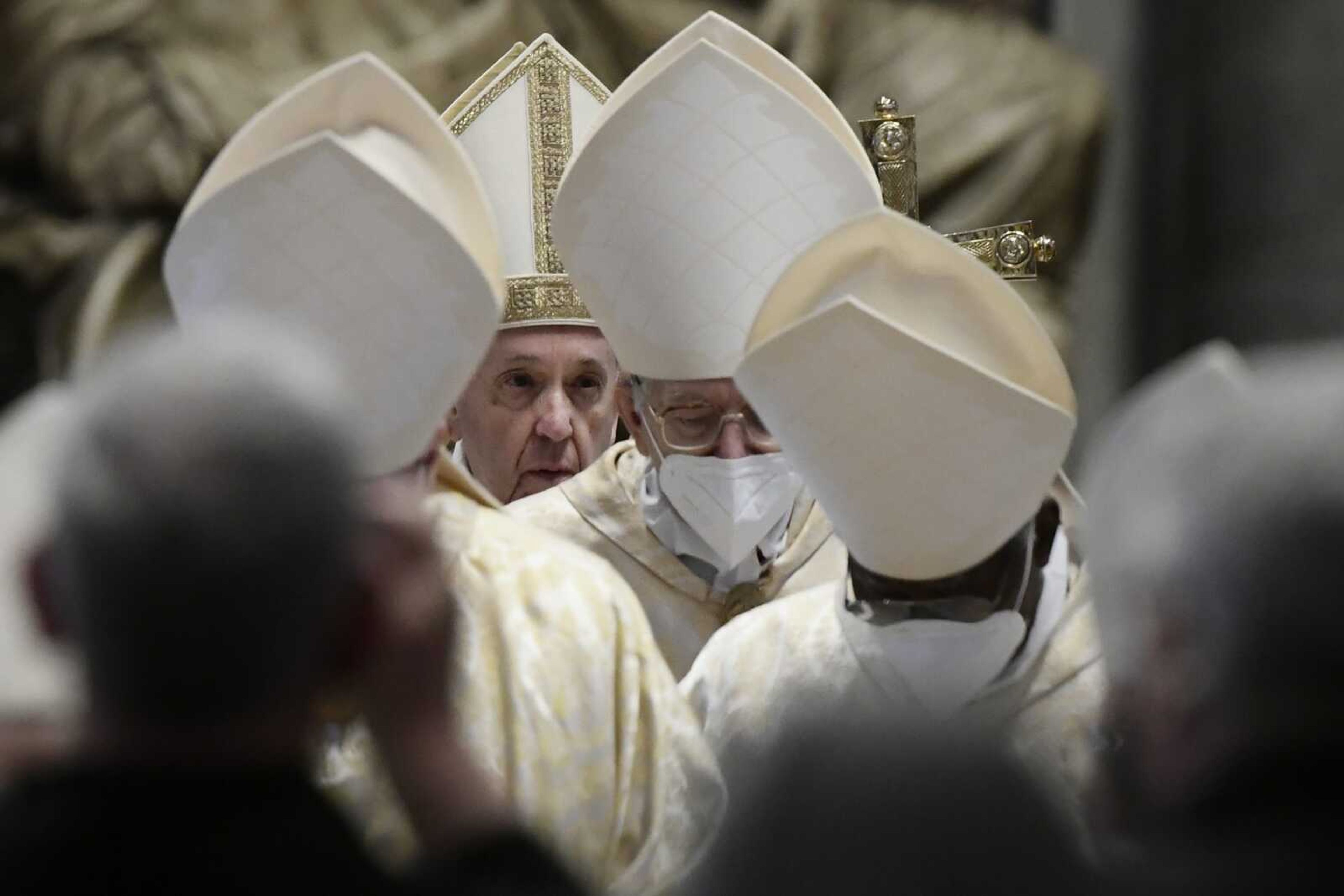 Pope Francis leaves after celebrating Easter Mass on Sunday at St. Peter's Basilica at The Vatican.