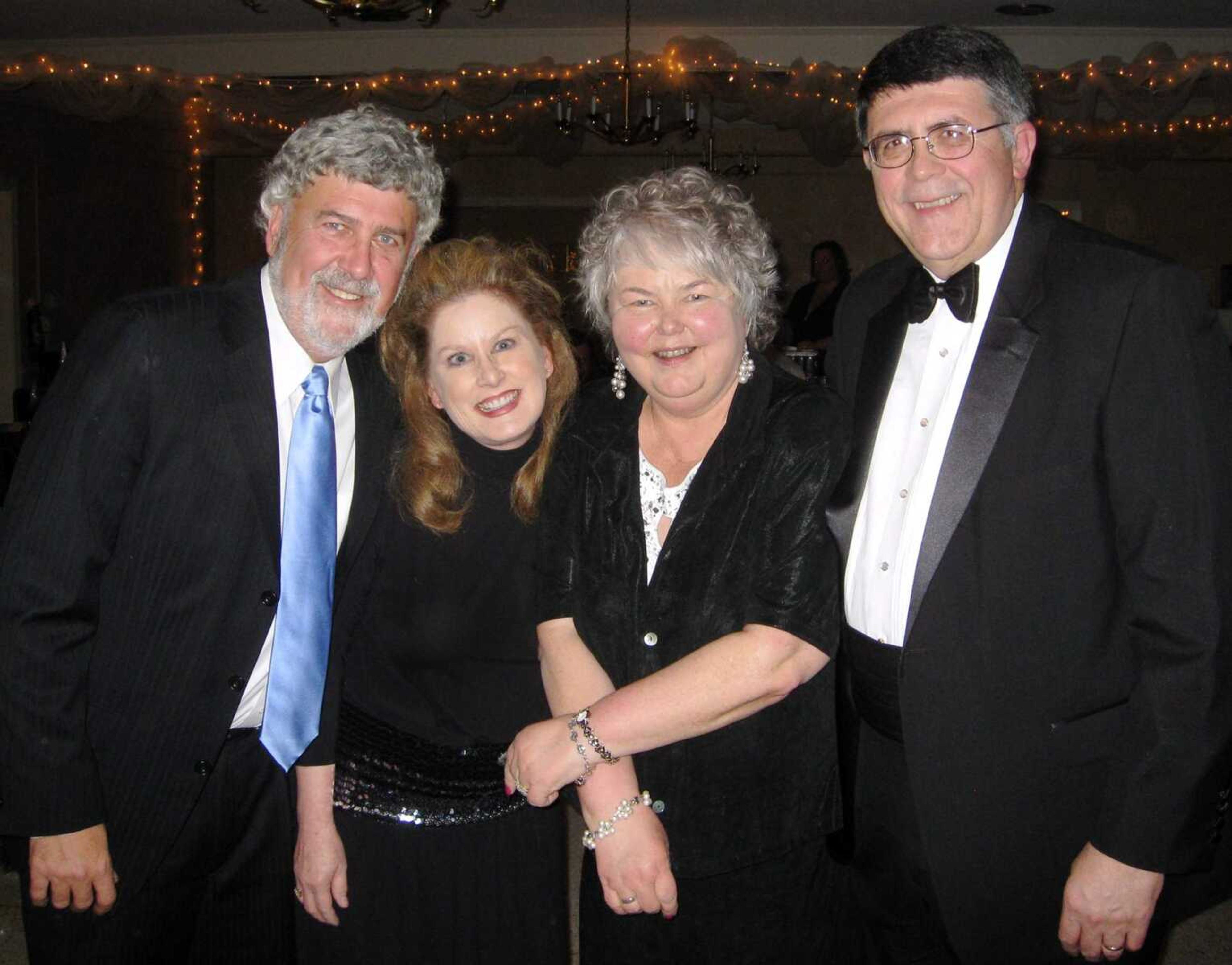 Michael Kohlfeld, left, Barbara Kohlfeld, Jeanine Dobbins and Ken Dobbins pose at the Penguin Party.