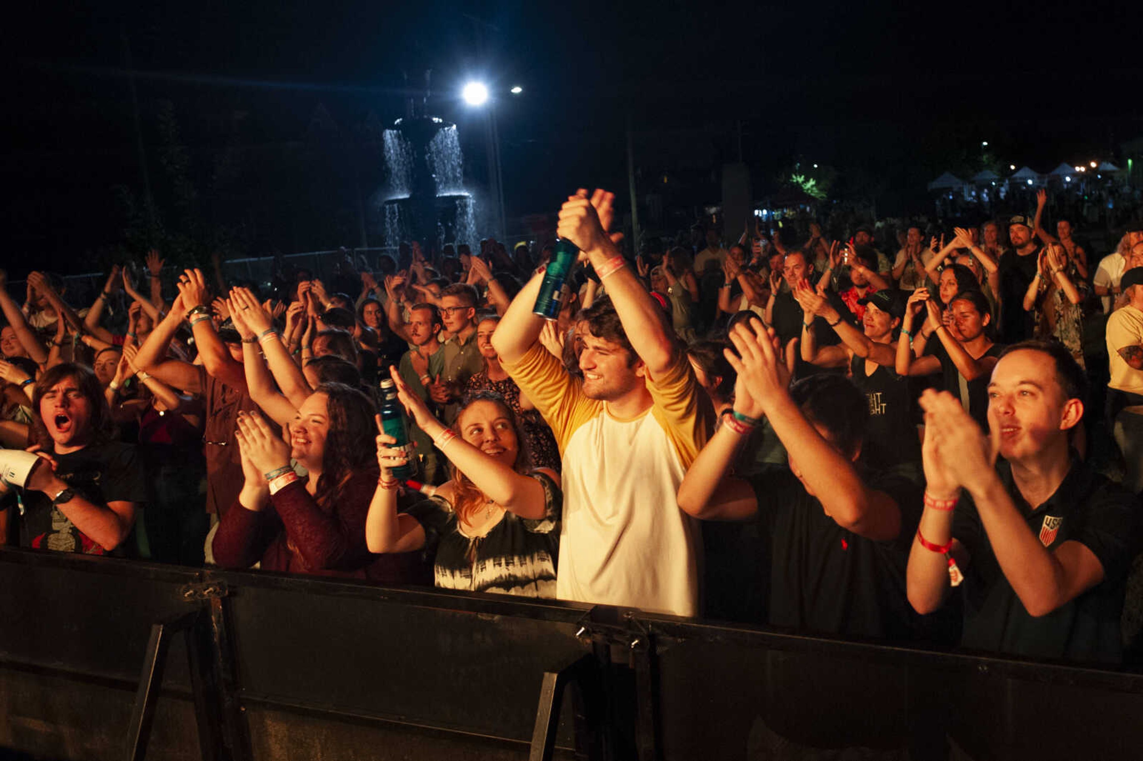 Front and center three fans from left: Veronica Young, Maddie Noonan and Ben Wedemeier, clap with other fans as Dawson Hollow plays on stage during Shipyard Music and Culture Festival on Friday, Sept. 27, 2019, in Cape Girardeau.