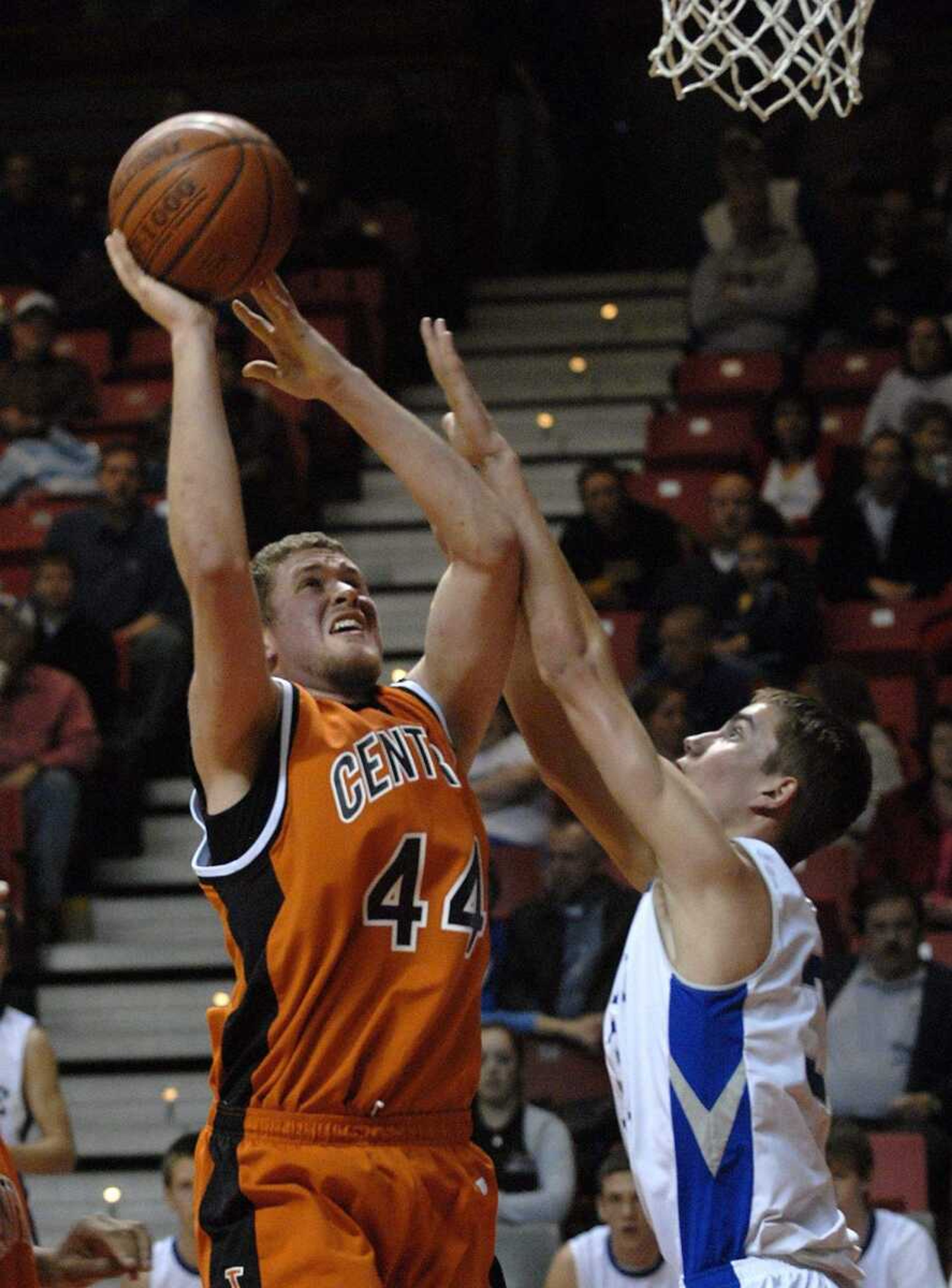 FRED LYNCH ~ flynch@semissourian.com
Central's Zack Boerboom shoots over Notre Dame's Jacob Tolbert in the first quarter Monday at the Show Me Center.