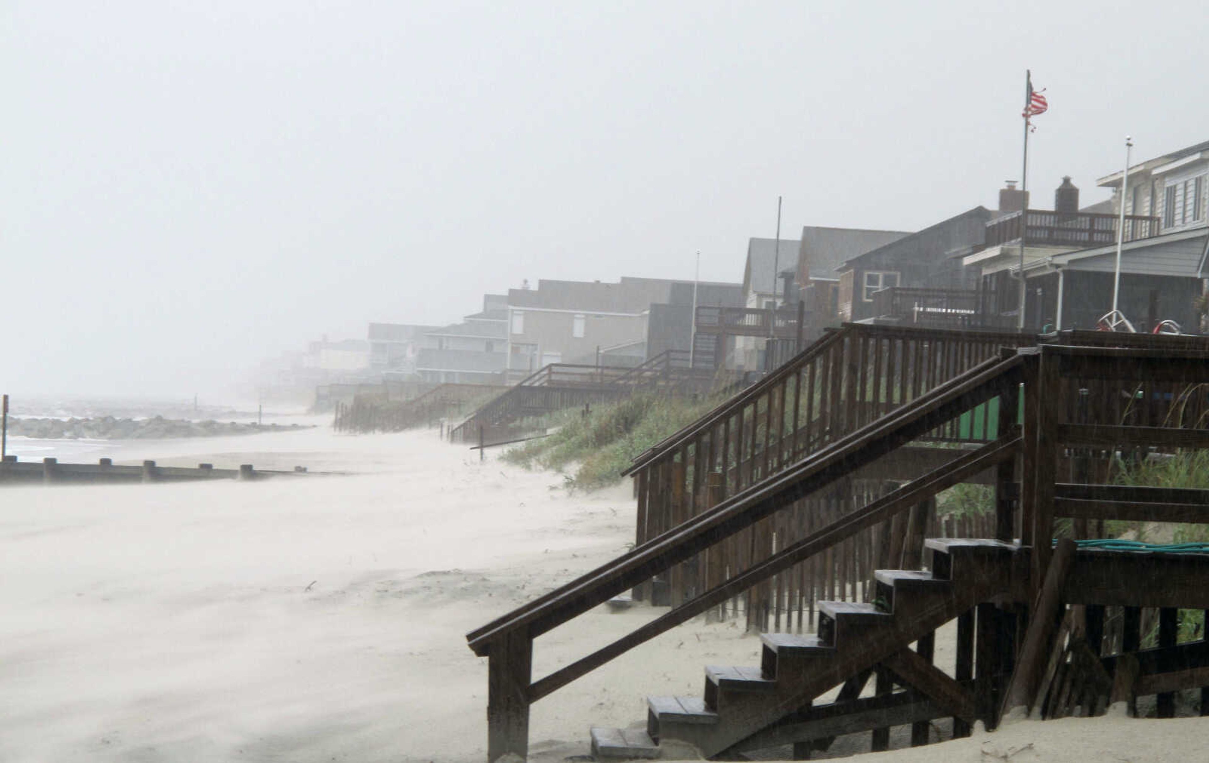 Heavy rains and wind from Hurricane Irene whip the sand on the beach at Pawleys Island, S.C., Friday, Aug. 26, 2011. Hurricane Irene began lashing the East Coast with rain Friday ahead of a weekend of violent weather that was almost certain to heap punishment on a vast stretch of shoreline from the Carolinas to Massachusetts. (AP Photo/Bruce Smith)