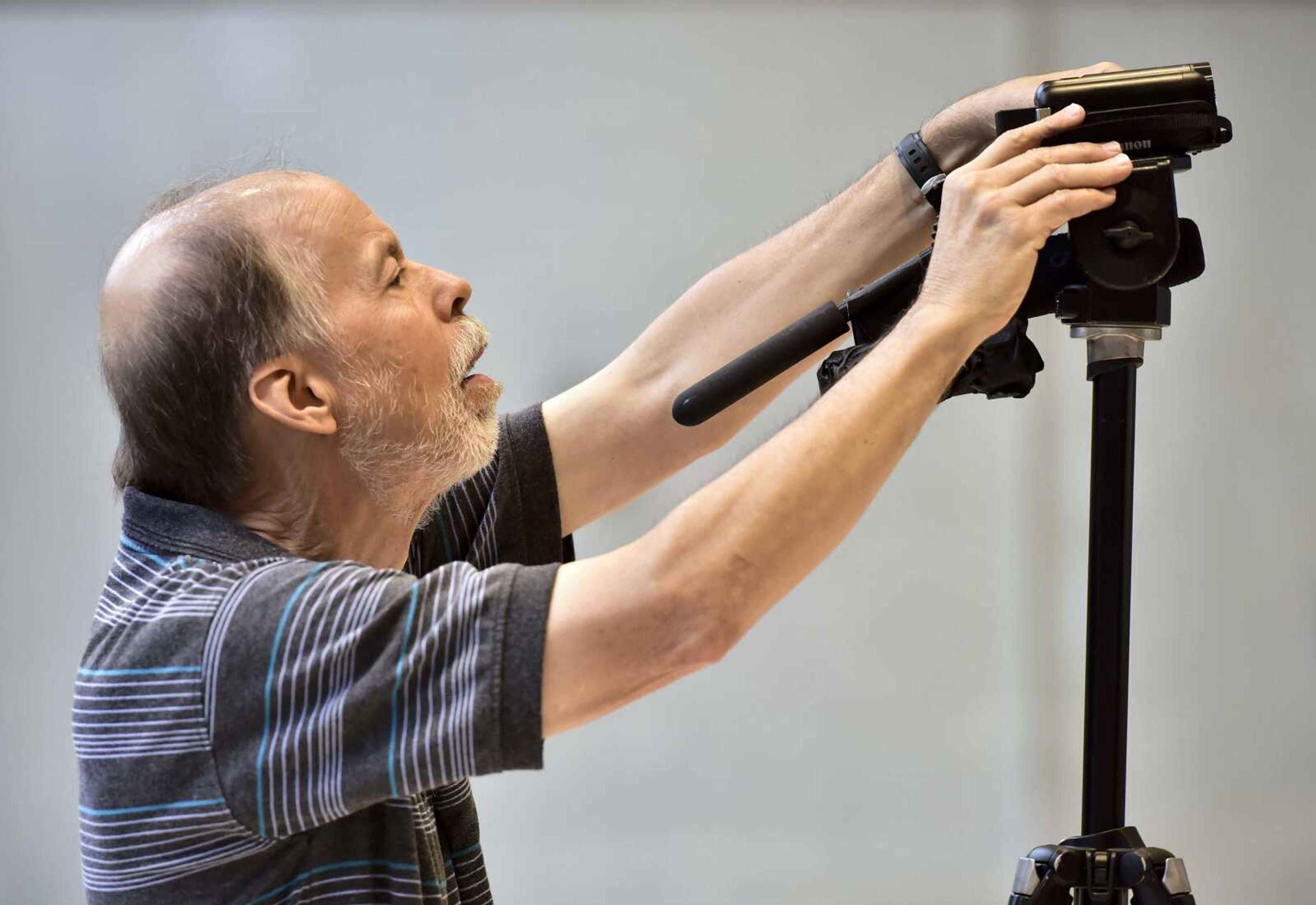 Fred Lynch adjusts a camcorder at his retirement party Friday, Aug. 24, 2018 in the Bullpen at the Rust Center for Media in Cape Girardeau. Lynch spent the past 43 years as a photojournalist at the Southeast Missourian.